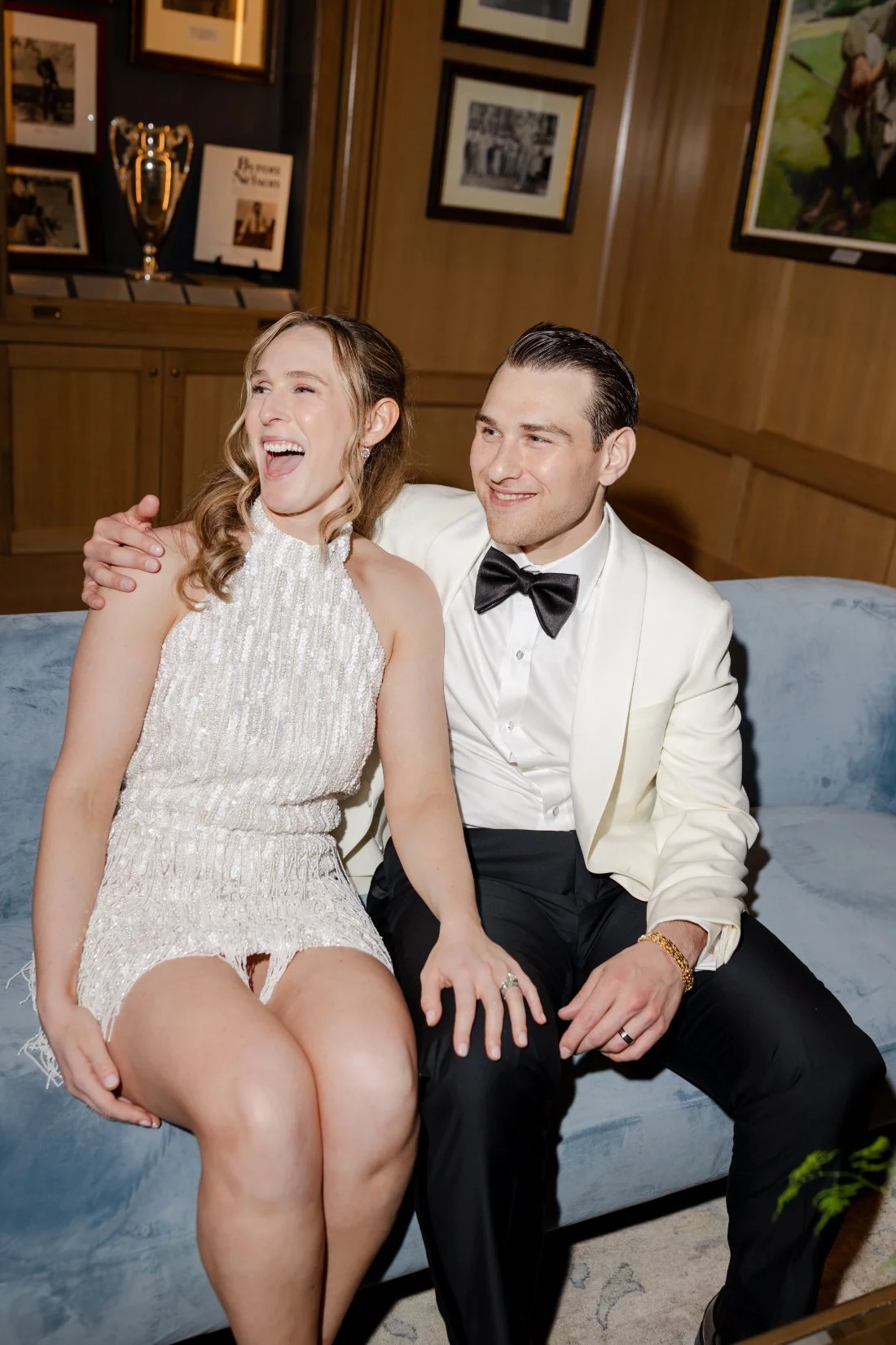 Amanda and Ethan laughing together during their Quaker Ridge Golf Club wedding after-party.