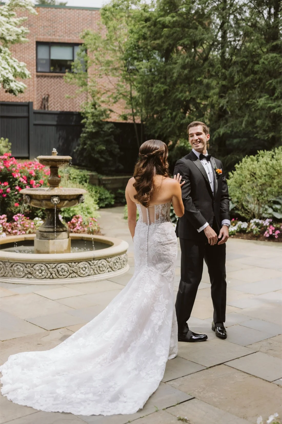 Matt turns around and smiles at Sydney during their romantic first look at Tappan Hill Mansion in Tarrytown, New York.