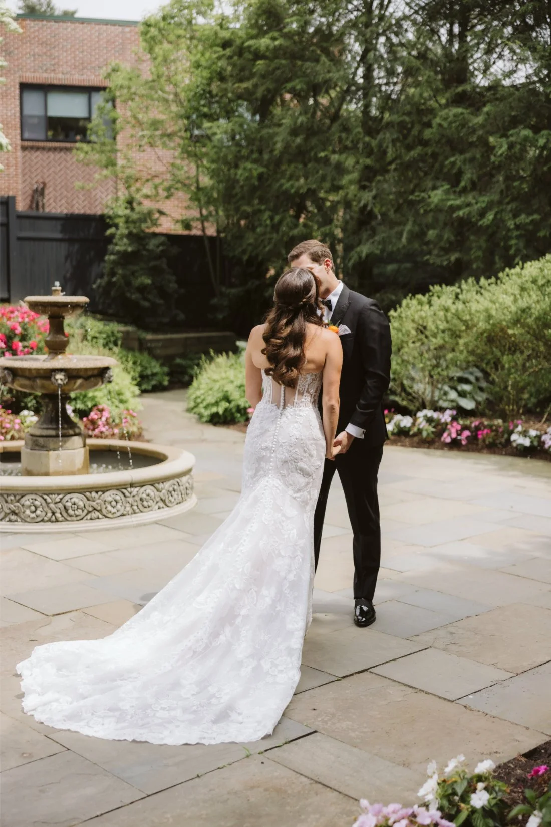 bride and groom kiss at first looks