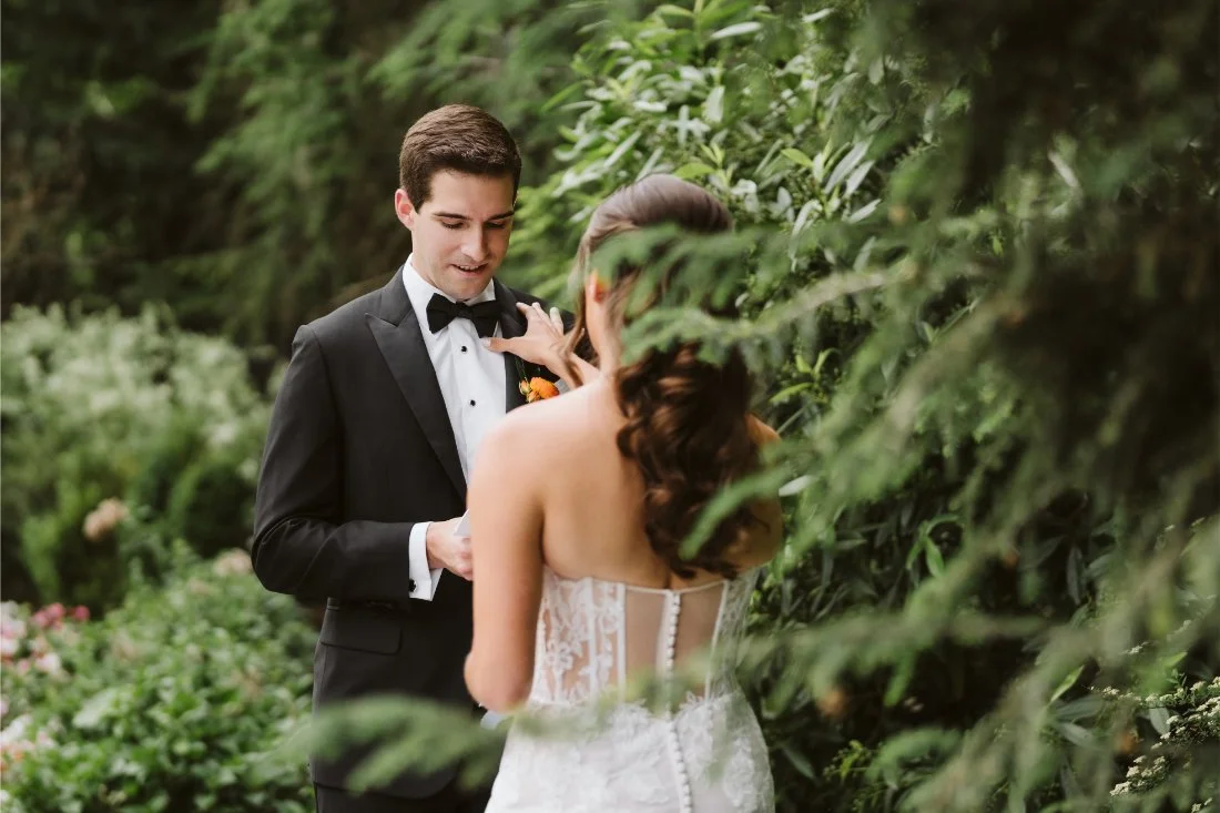 Sydney and Matt share a quiet moment exchanging private vows surrounded by lush greenery during their Tappan Hill Mansion wedding.