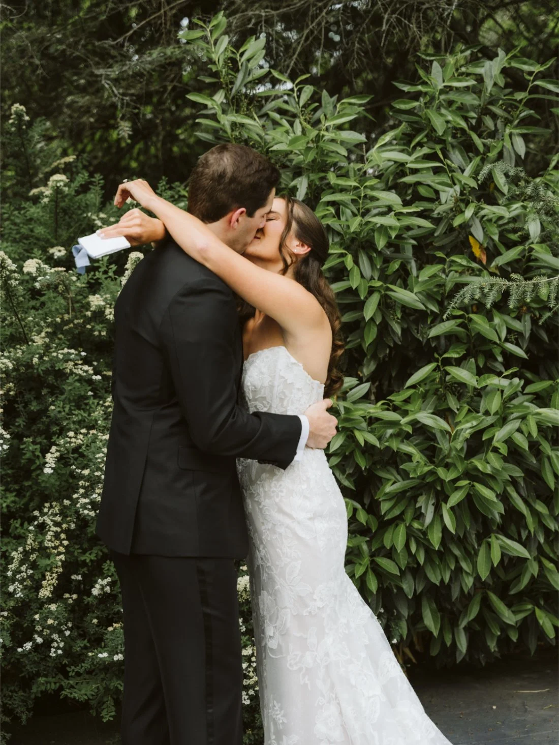 bride and groom kiss during private vow reading