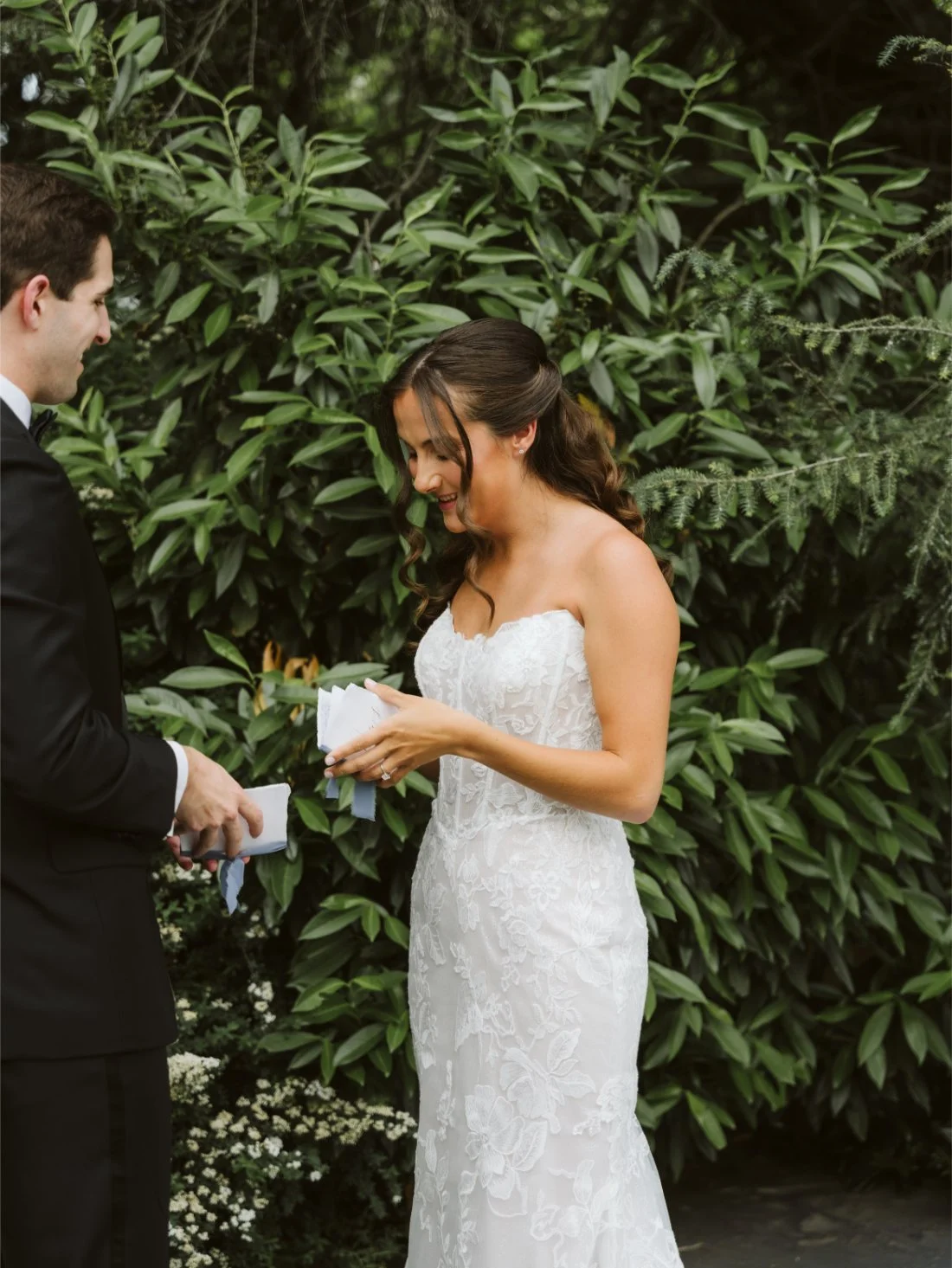 Sydney smiles while reading her personal vows to Matt during their intimate wedding first look at Tappan Hill Mansion.