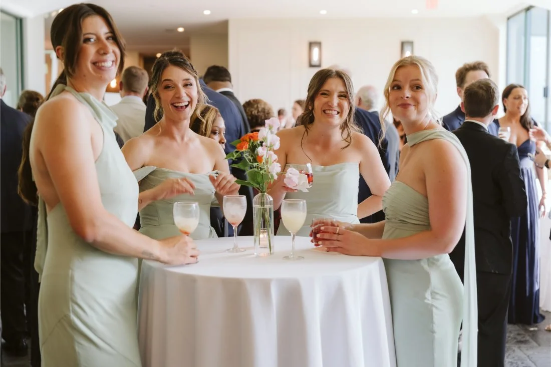 bridesmaids and bride gather together at the cocktail hour 