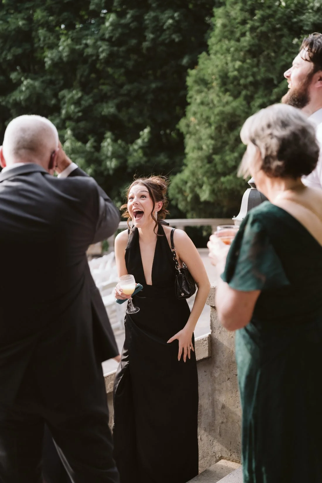 guest laughing and mingling at cocktail hour
