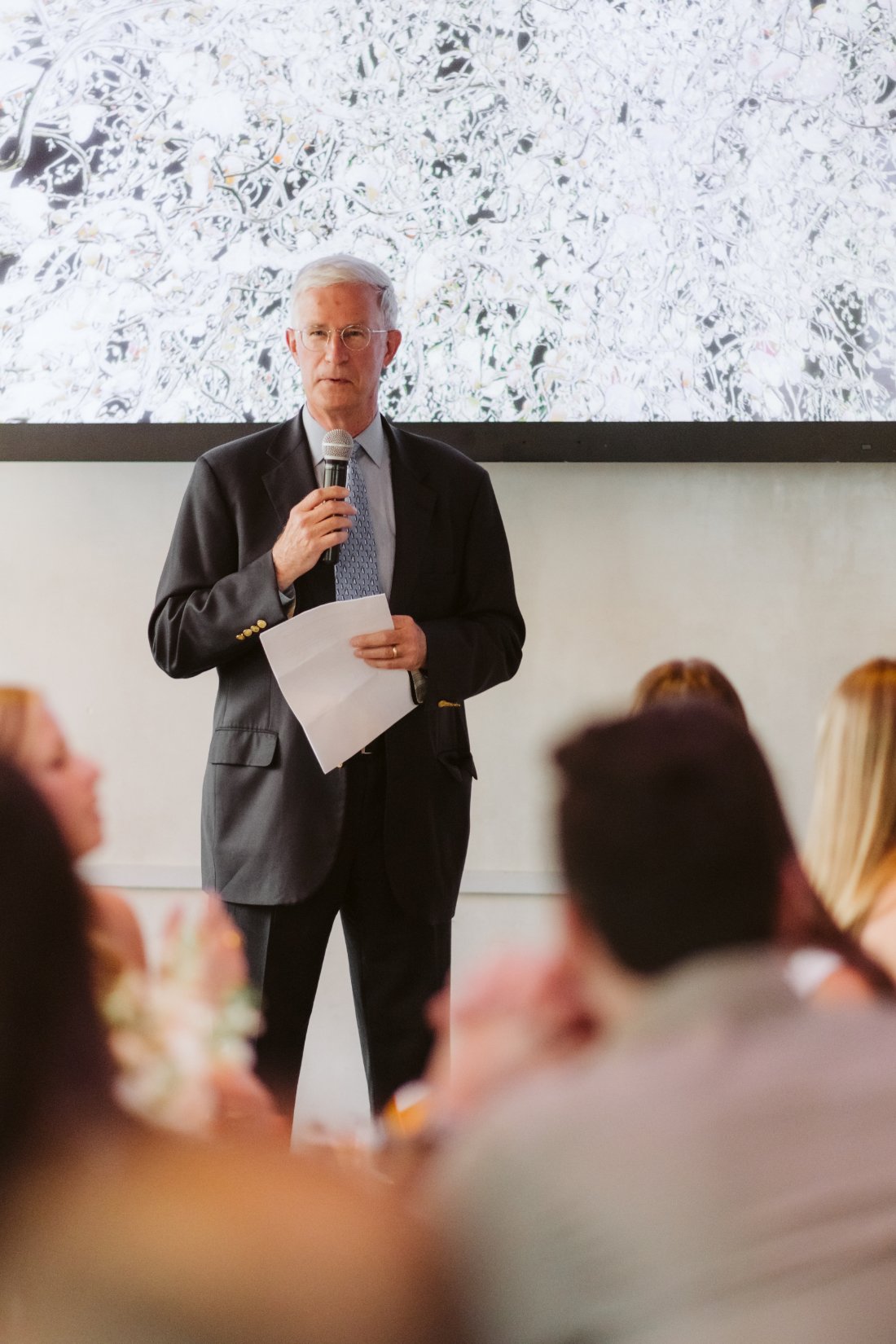 Family member delivers a heartfelt speech during the rehearsal dinner before a Tappan Hill Mansion wedding.