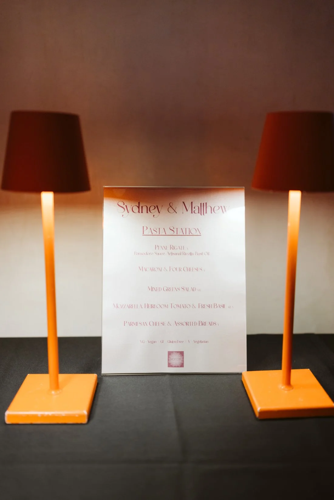 Italian pasta station featuring warm dishes and orange table lamps before a Tappan Hill Mansion wedding.