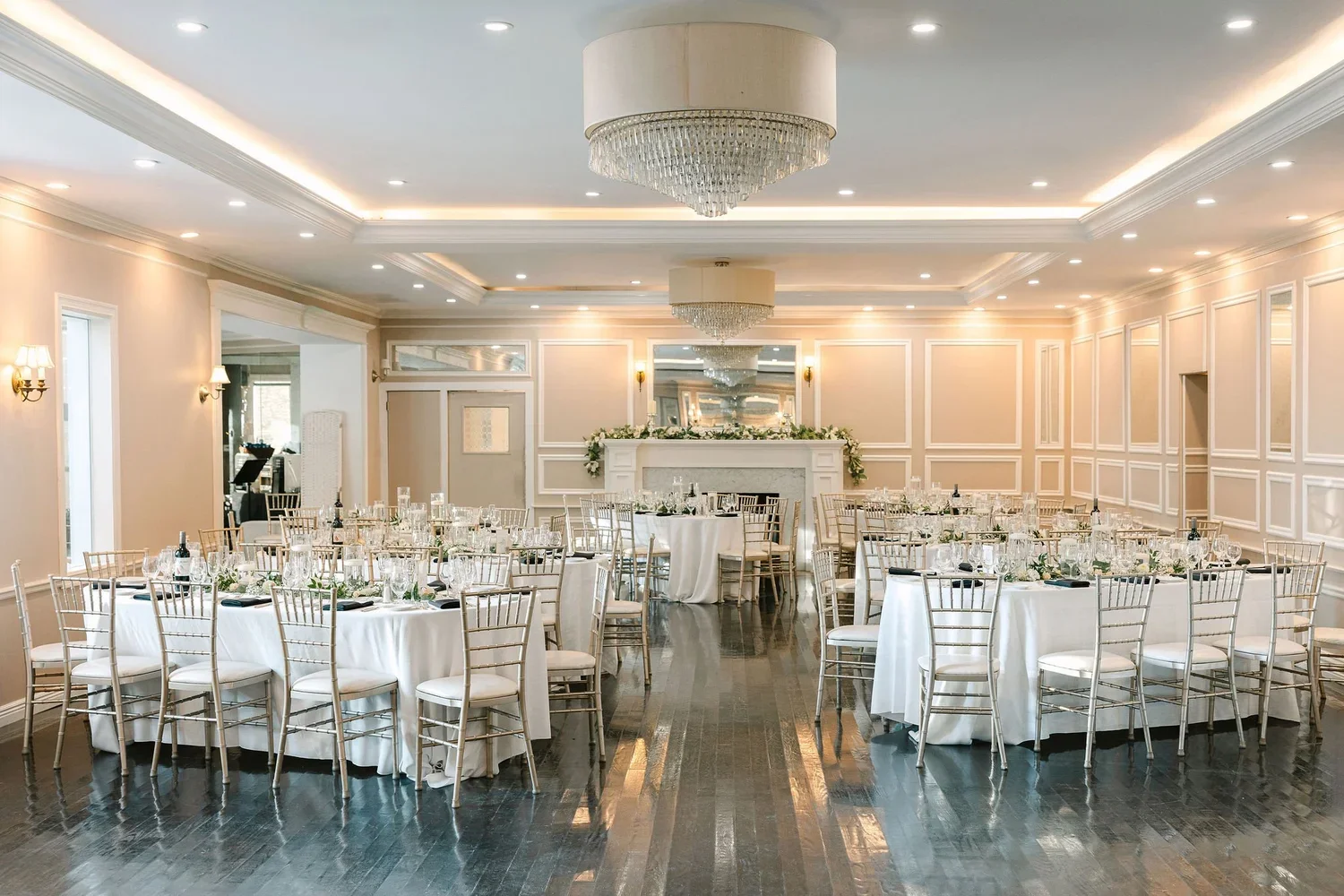 Elegant wedding reception space with white and gold décor, highlighting the importance of a detailed wedding planner checklist for flawless event execution.