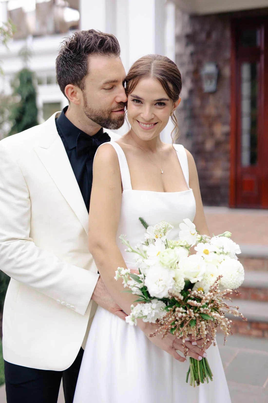 bride and groom sharing in a romantic photo session at the Peconic Bay yacht club in New York