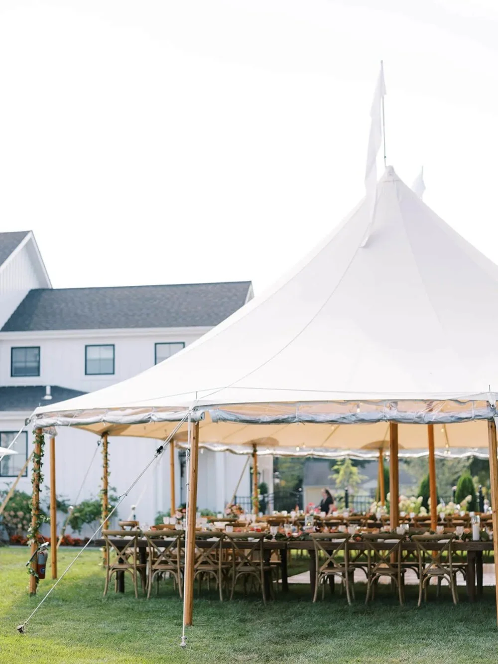 Elegant sailcloth wedding tent with long reception tables demonstrating an outdoor wedding rain plan for a New York wedding