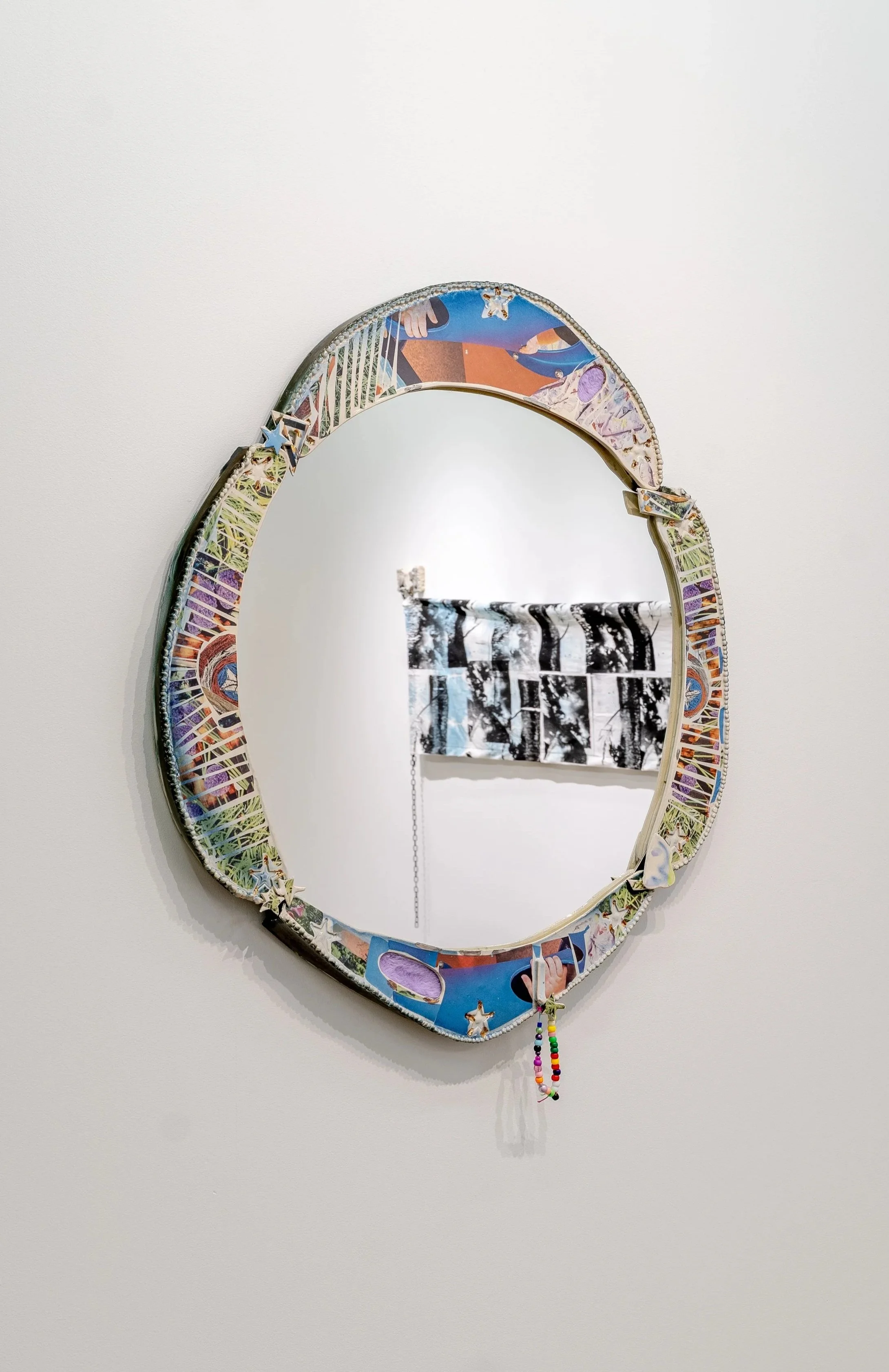 Becoming a Superhero in 24 Hours!
Glazed ceramic, wood, mirror, photographs, luster, plush
30” x 26”
2026