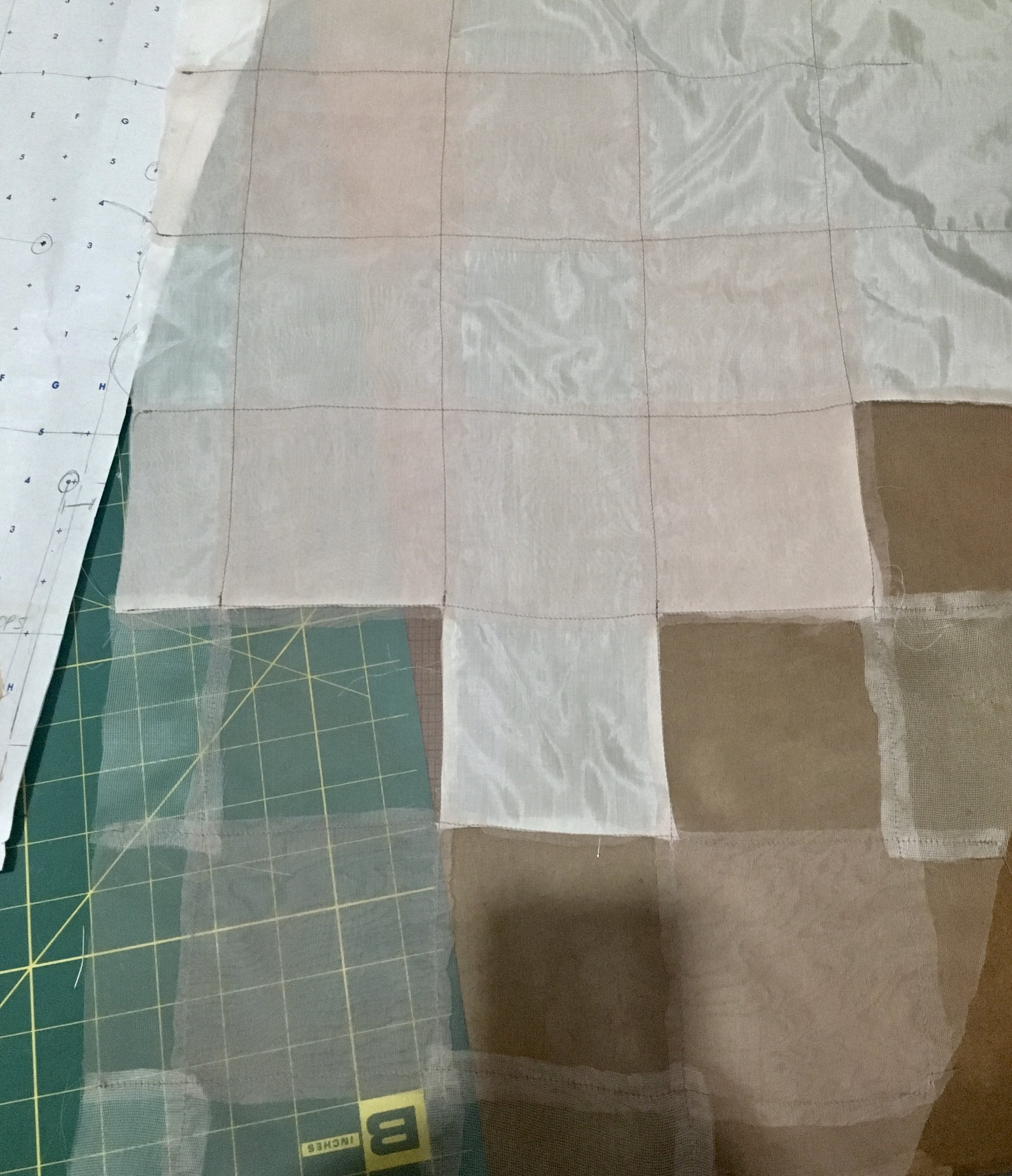 developing a constructed plaid out of mesh, organza, and habotai