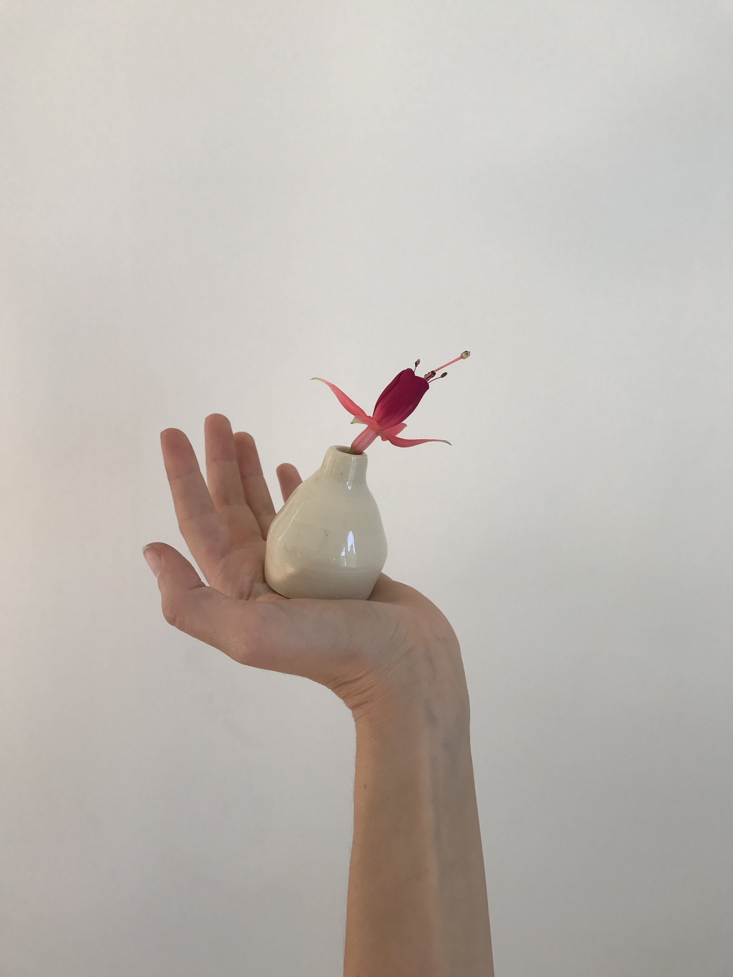 A lopsided vessel, hand-thrown.