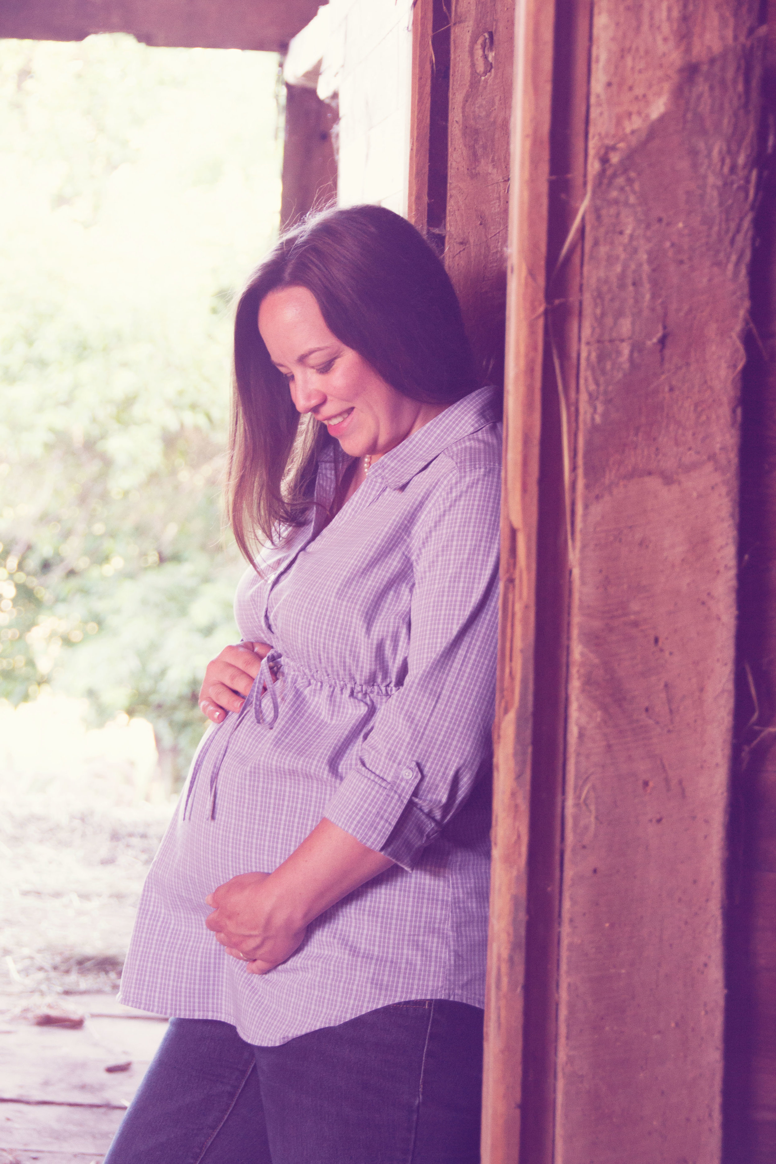 m in hay barn looking down at baby pastel edit.jpg