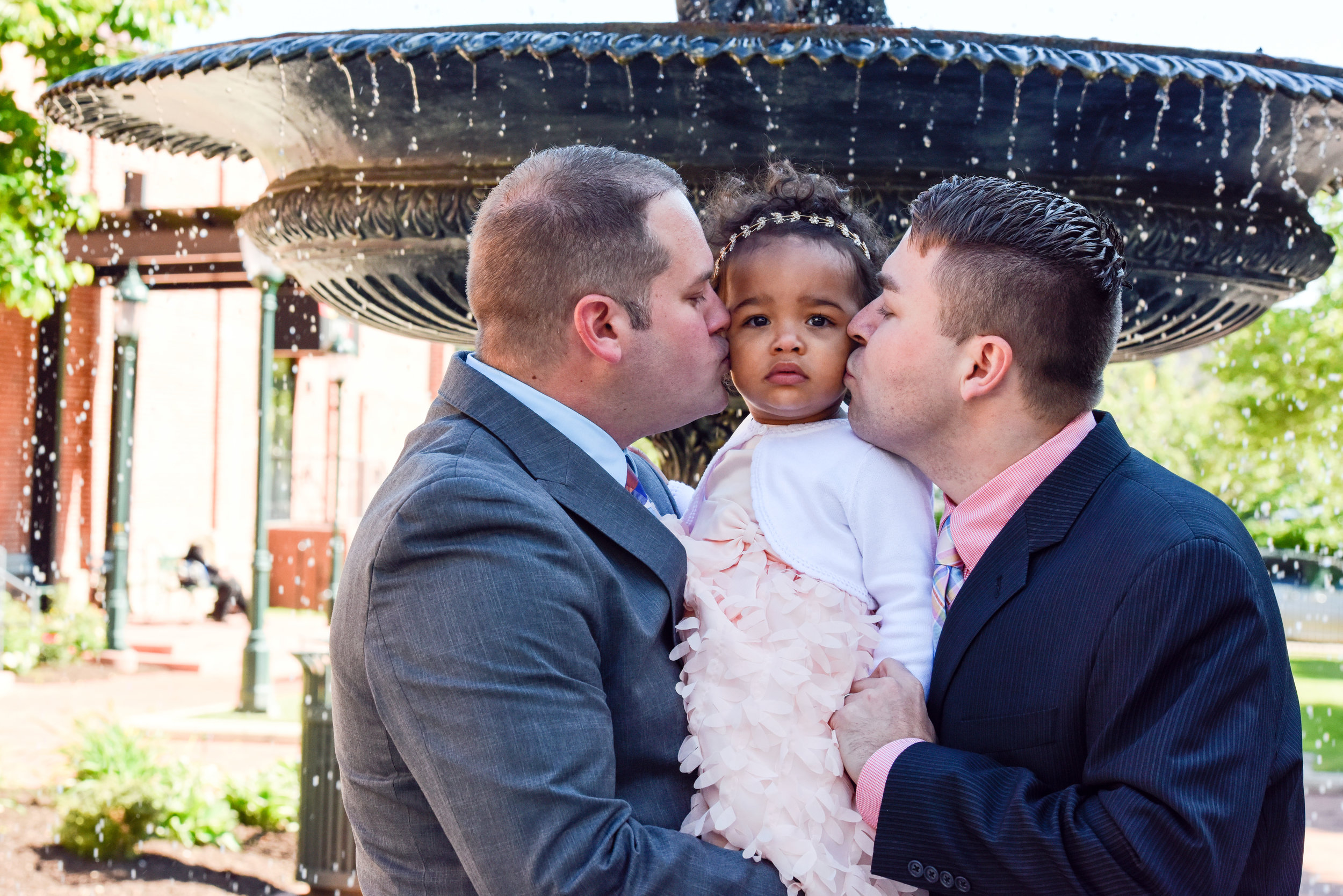 daddies kissing Ava's cheeks.jpg