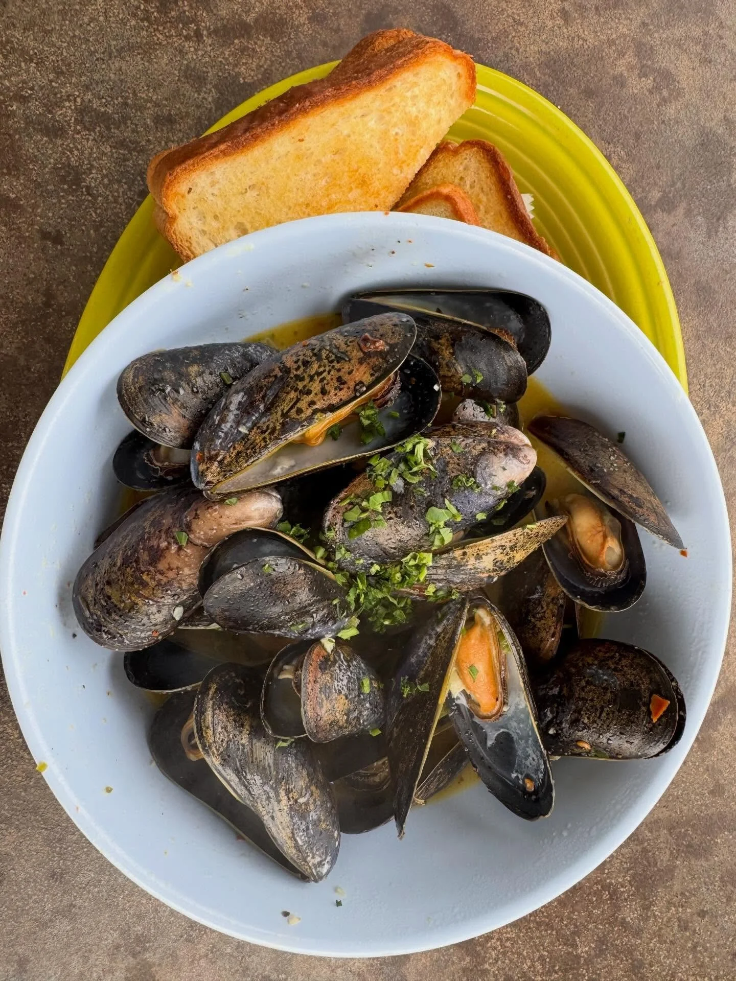 Our Muscles are back by Popular Demand! Soaked in a hot broth of white wine and garlic butter, these will definitely warm you up on a crisp winter day!