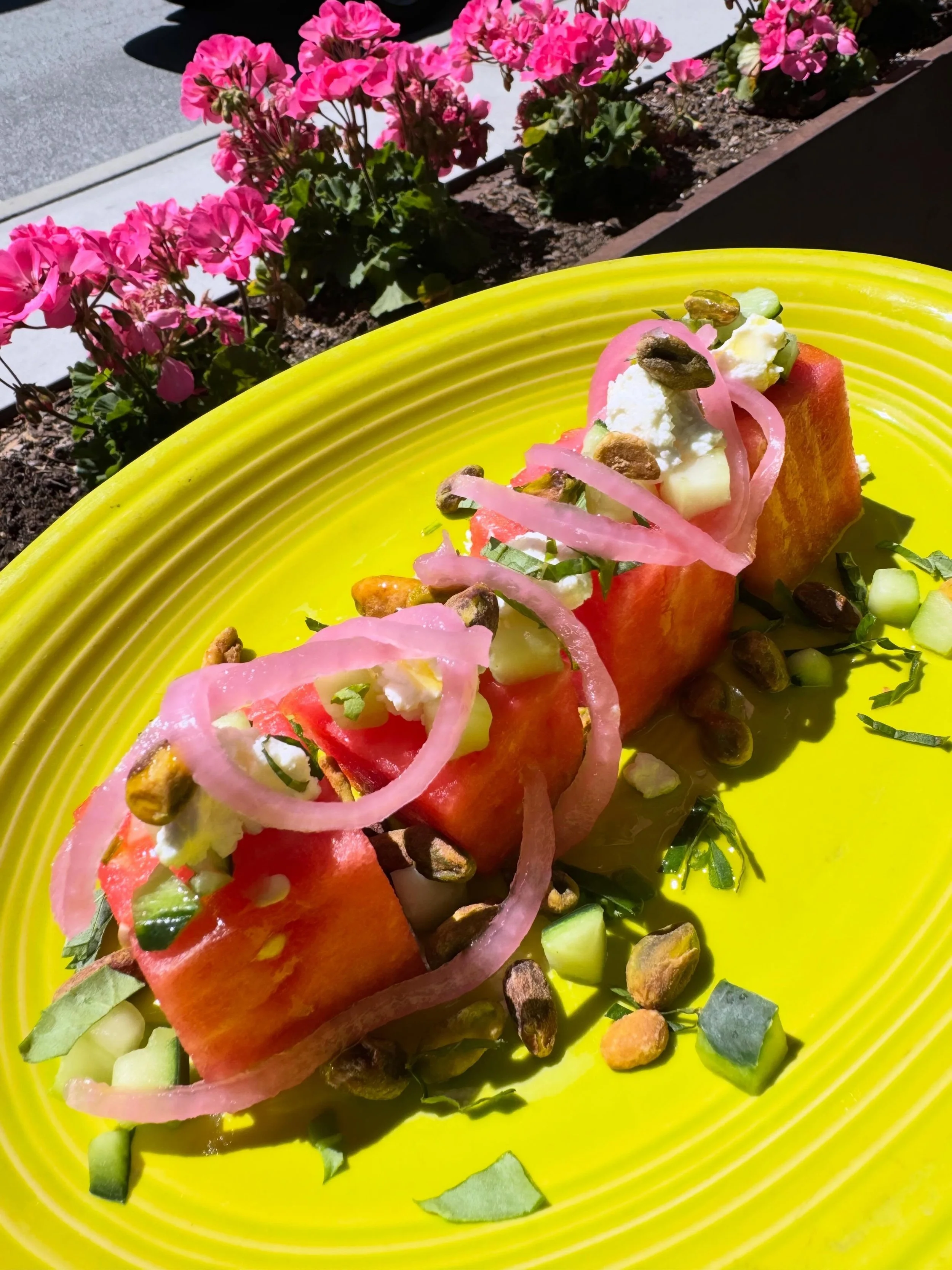 A Fresh Delicious Salad just for you !! With fresh watermelon, cucumber, freshly picked mint, goat cheese, pistachio, pickled red onion and a balsamic glaze, this salad will be sure to refresh your taste buds!! On the board at Bluetop now!