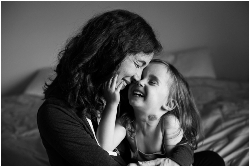 Lifestyle Family Photographer Rochester NY mama and little girl smiling