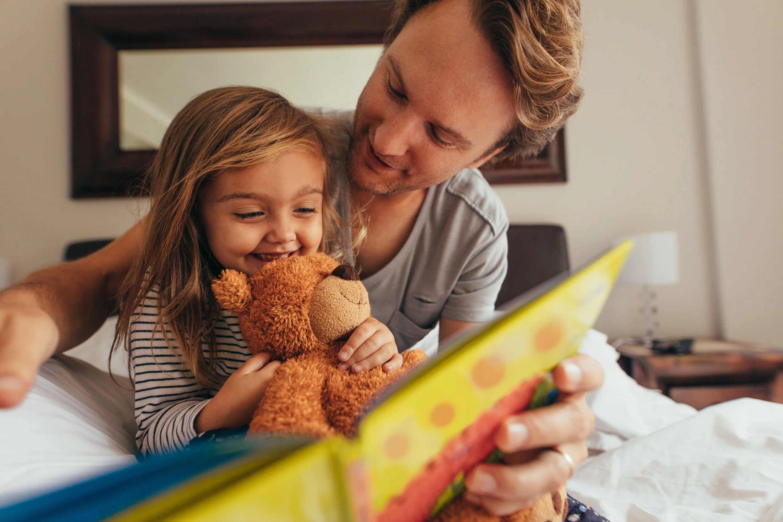 Dad Reading with Daughter.jpeg