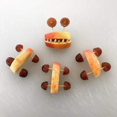 Some cute apple snacks we made in our last class. Instead of snacking on potato chips and soda, the kids absent-mindedly noshed on apples, grapes and sunflower seeds for an hour!!
