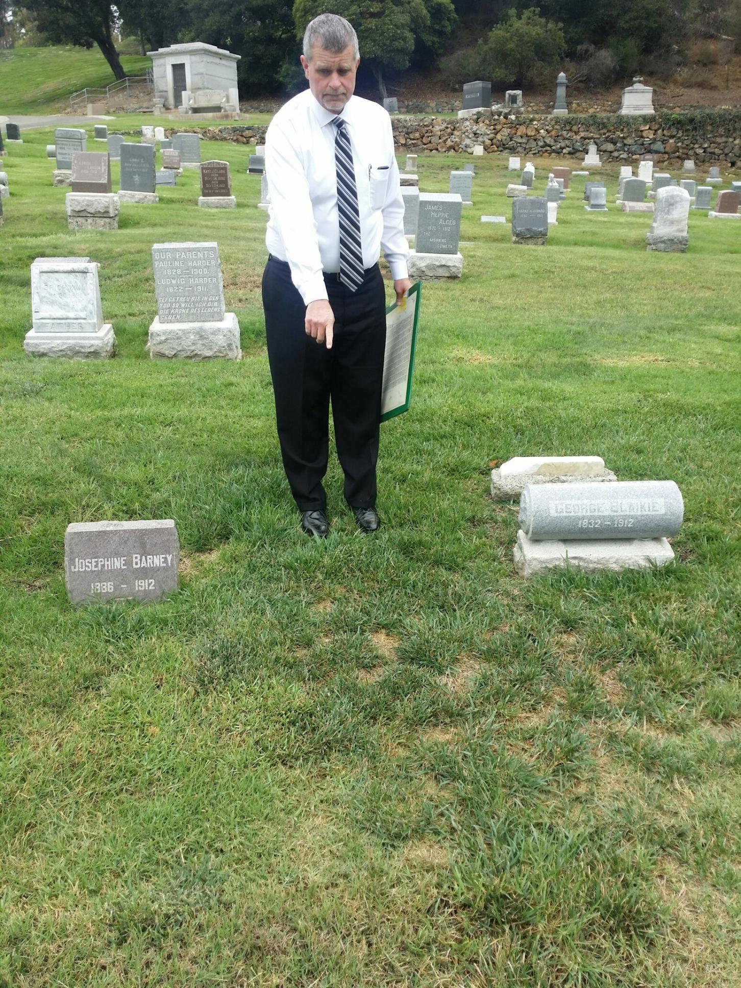 Scott Pennington, t he General Manager of Sunset View cemetery in El Cerrito, points to the unmarked grave of Andrew W. Lindquist