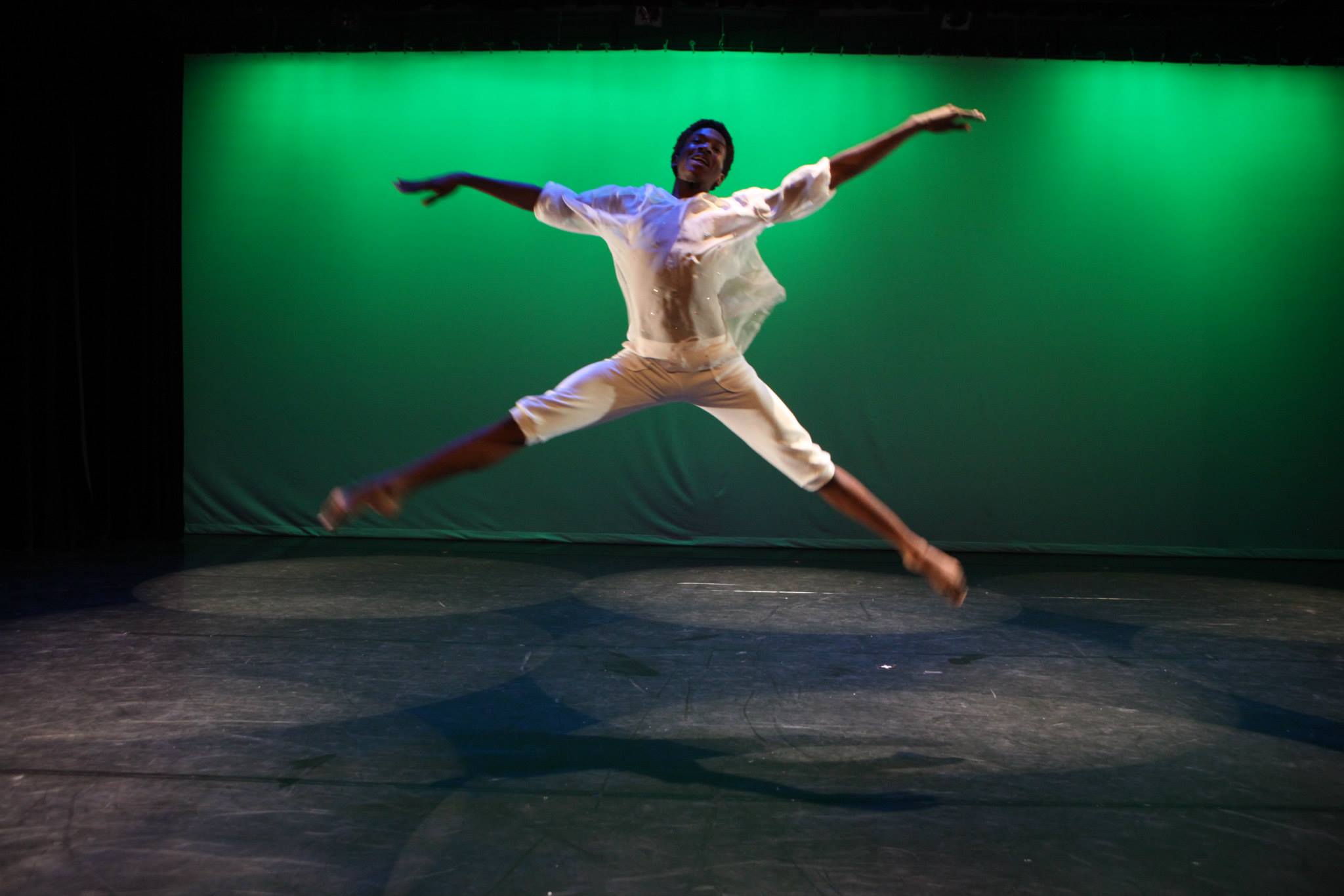 Youth Dancer Boy leaps green background.jpg