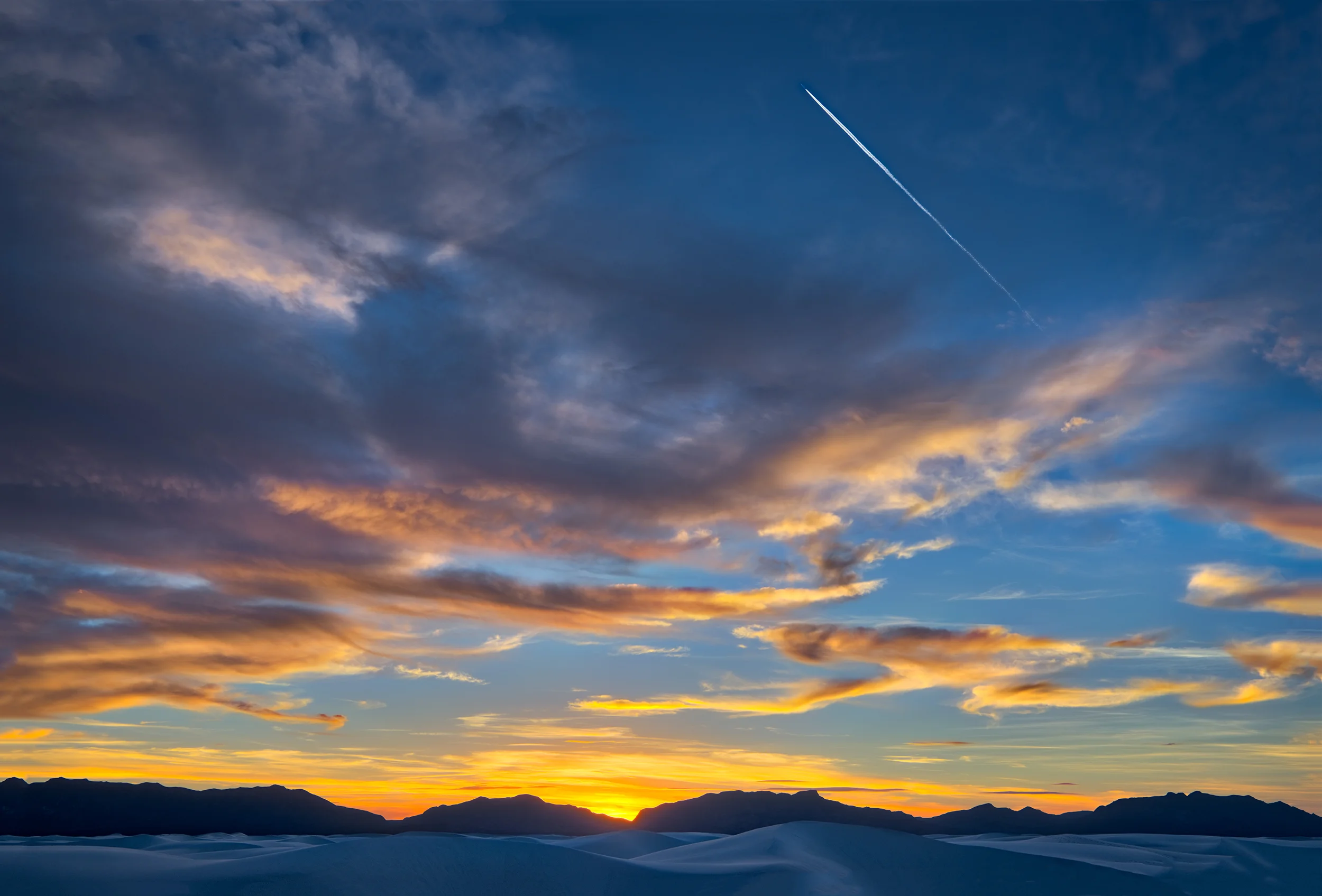 Sunset Clouds and Contrail, San Andres Mountains, Autumn, White Sands National Monument , New Mexico
