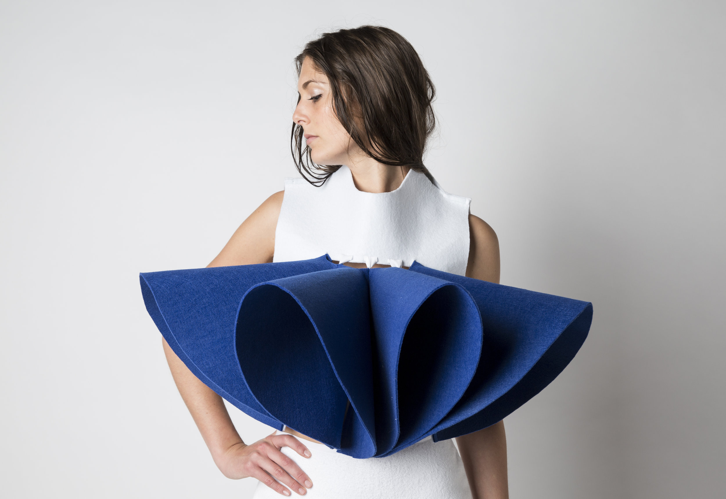   BUILDING UP THE BODY OF TODAY INTERACTING WITH TOMORROW This project talks about wearable surfaces, which upgrade themselves to the decomposed contemporary time, sectioning the individual who lives into that. That's the result of a medium which ins