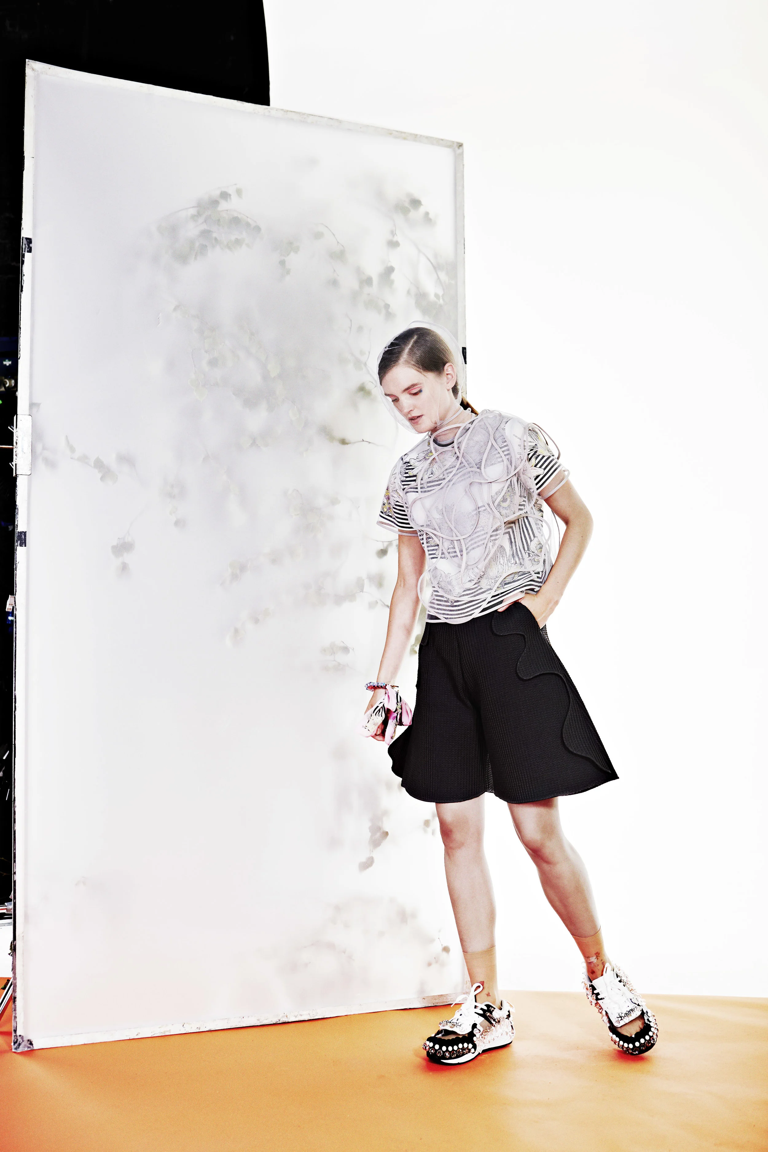    
  
 
  
  We followed on with distorted crepe pieces that we then draped and overlaid on contemporary double faced neoprene and denim dresses. For a modern take on the traditional suit we have teamed a sleeveless belted coat with a pair of wide s