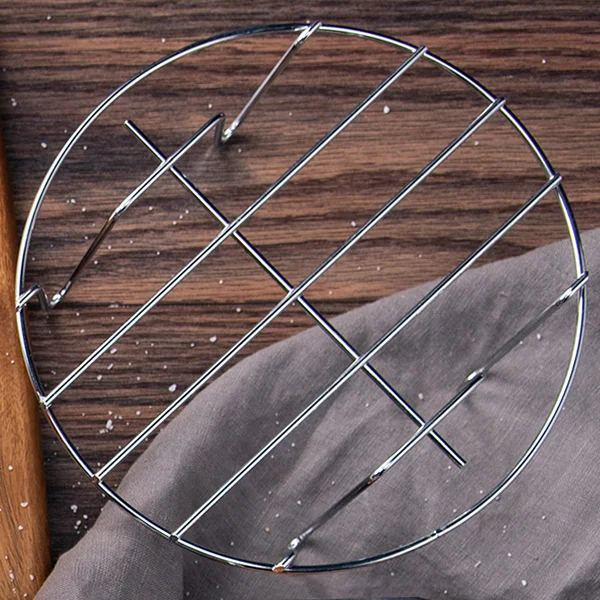 Metal Holder Excellent for cooking meat and fish. Elevates pans or the Egg Bites Mold, maximizing your cooking surface, and assists in easy removal.
