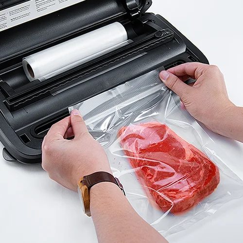 Step 1 Cut your bag from the vacuum sealer bag roll, and push down on the lid until you hear both corners click.