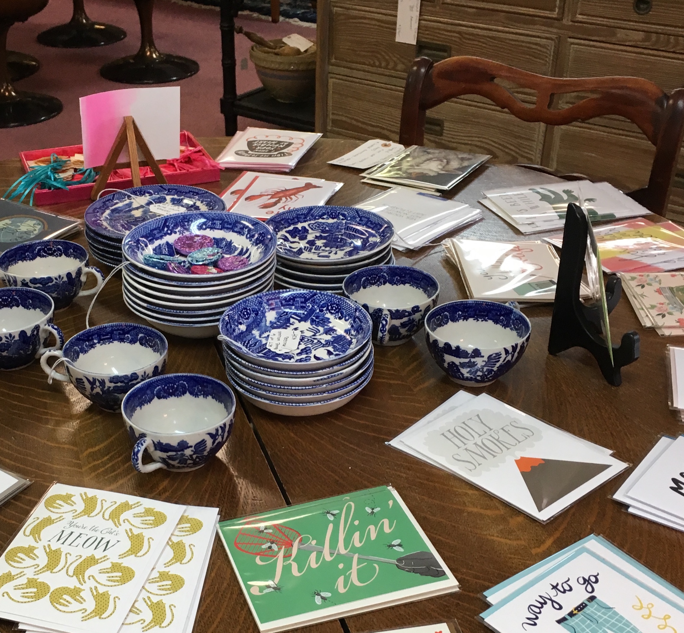 A cheeky selection of letterpress cards includes some from local Omaha artist, Ramona and Ruth. Kathleen is selective about the china and glassware she accepts, saying, "A lot of people want to sell it, and it's true, it is valuable. Unfortunately, it's not marketable. It's not dishwasher-safe, and people are just more minimalist right now. They don't have multiple sets of dishes." Exceptions can be made, however, such as with these blue cups and saucers that spoke to her Chinoiserie-lover's heart.