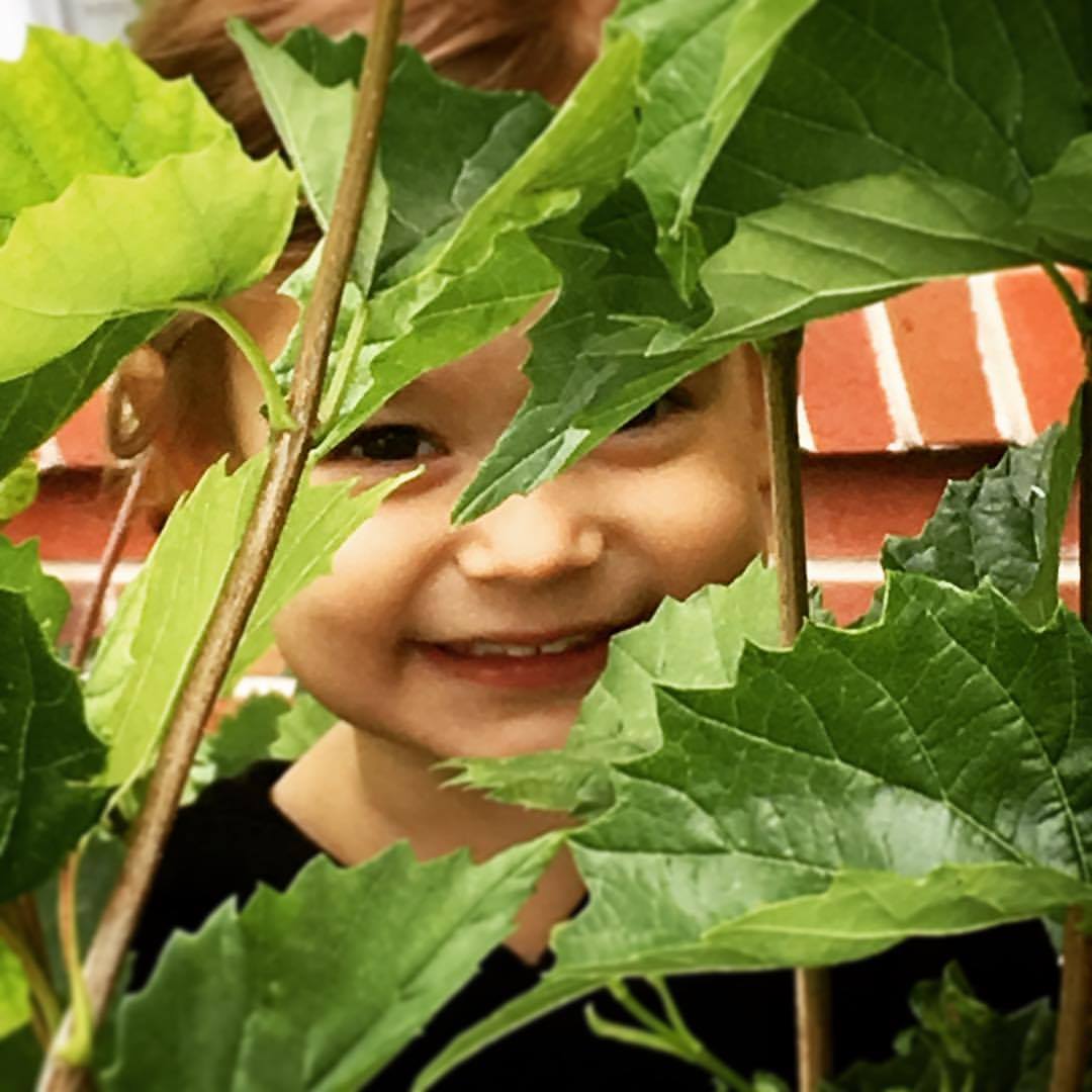 Kyle's daughter Baela, for whom his restaurant is named, in their garden (photo from Baela Rose)