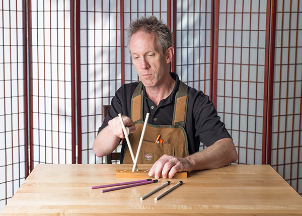 Using ceramic sharpening rods, set at the proper angle.