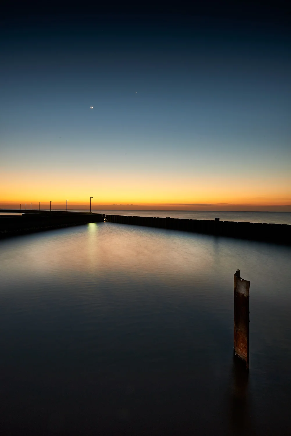 photographic image and fine art print of a sunset and pier photographed on Lake Okeechobee FL.