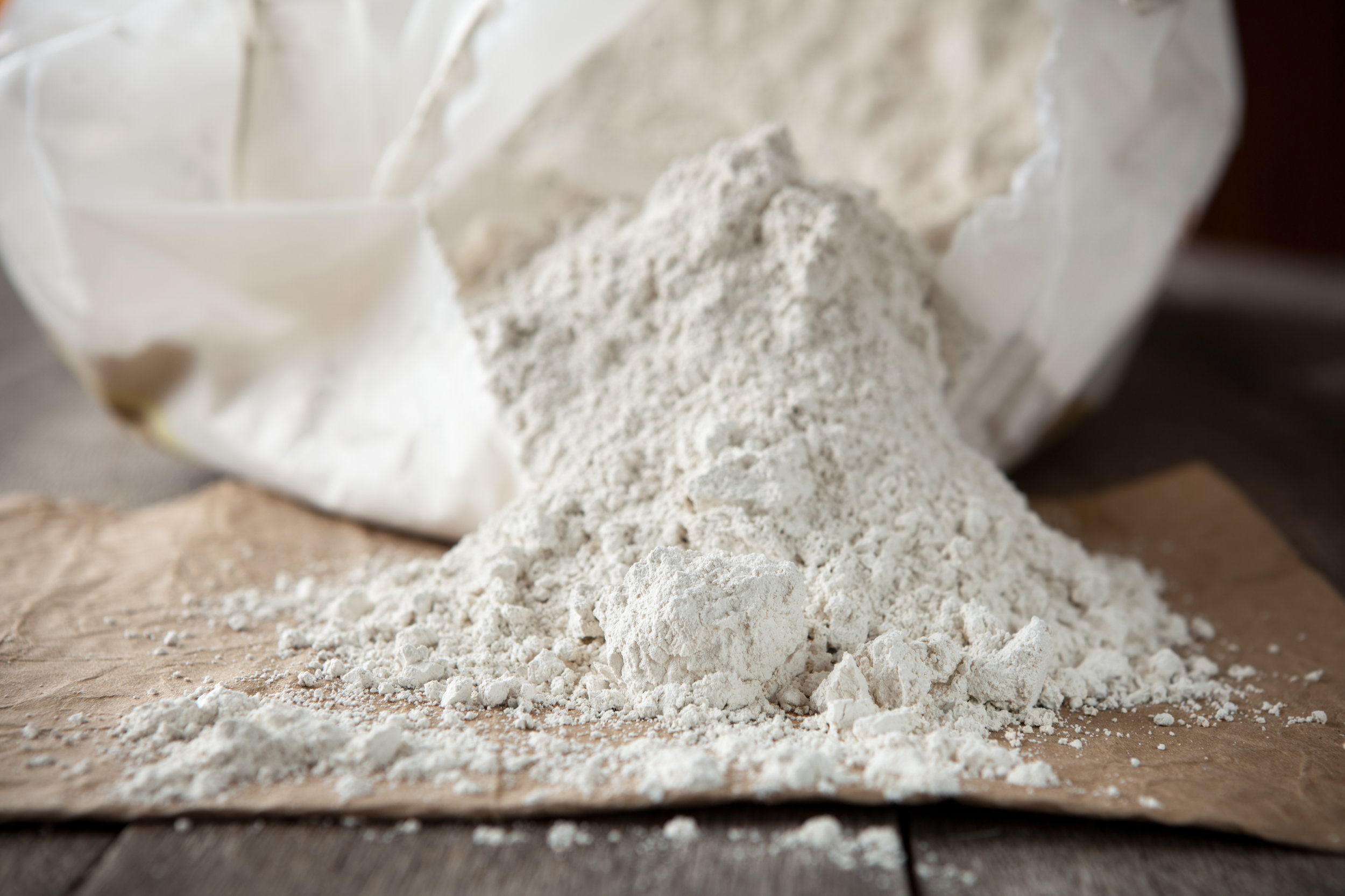 Industrial powder spilling out of bag for oil and gas industry