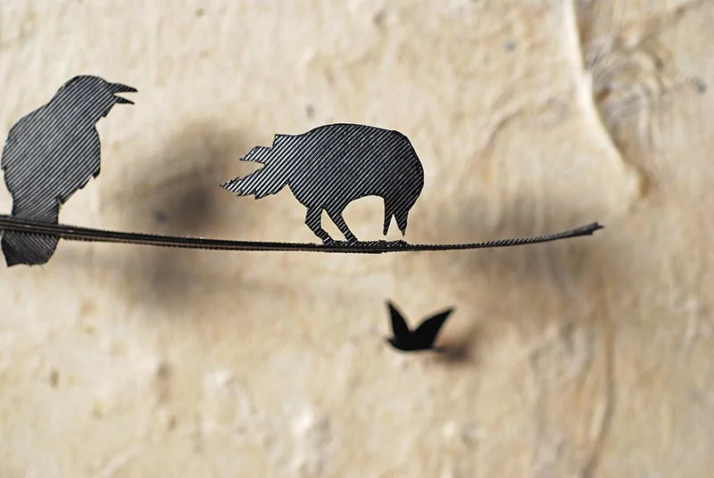 Crow feather cutout