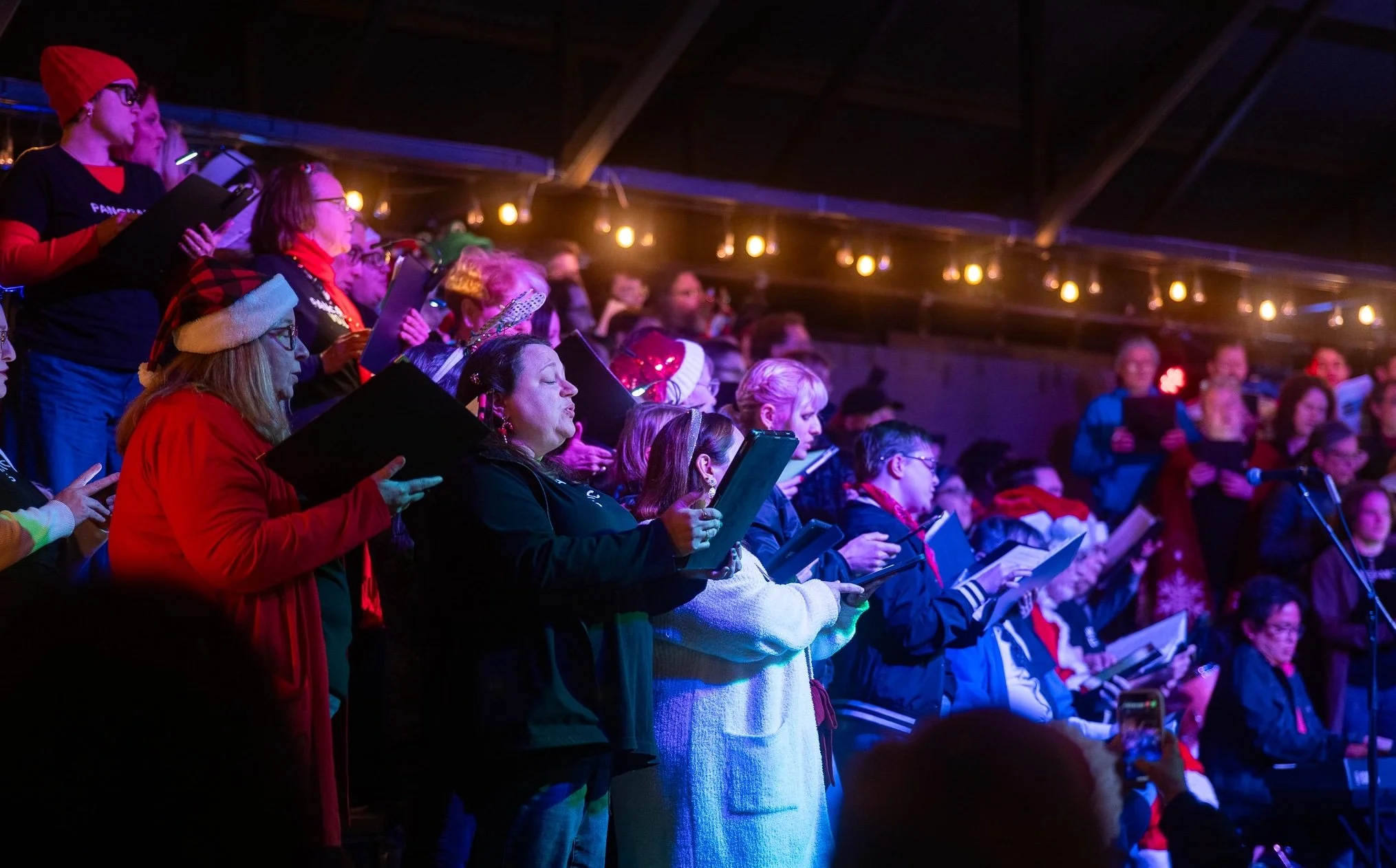 Singers in festive holiday garb