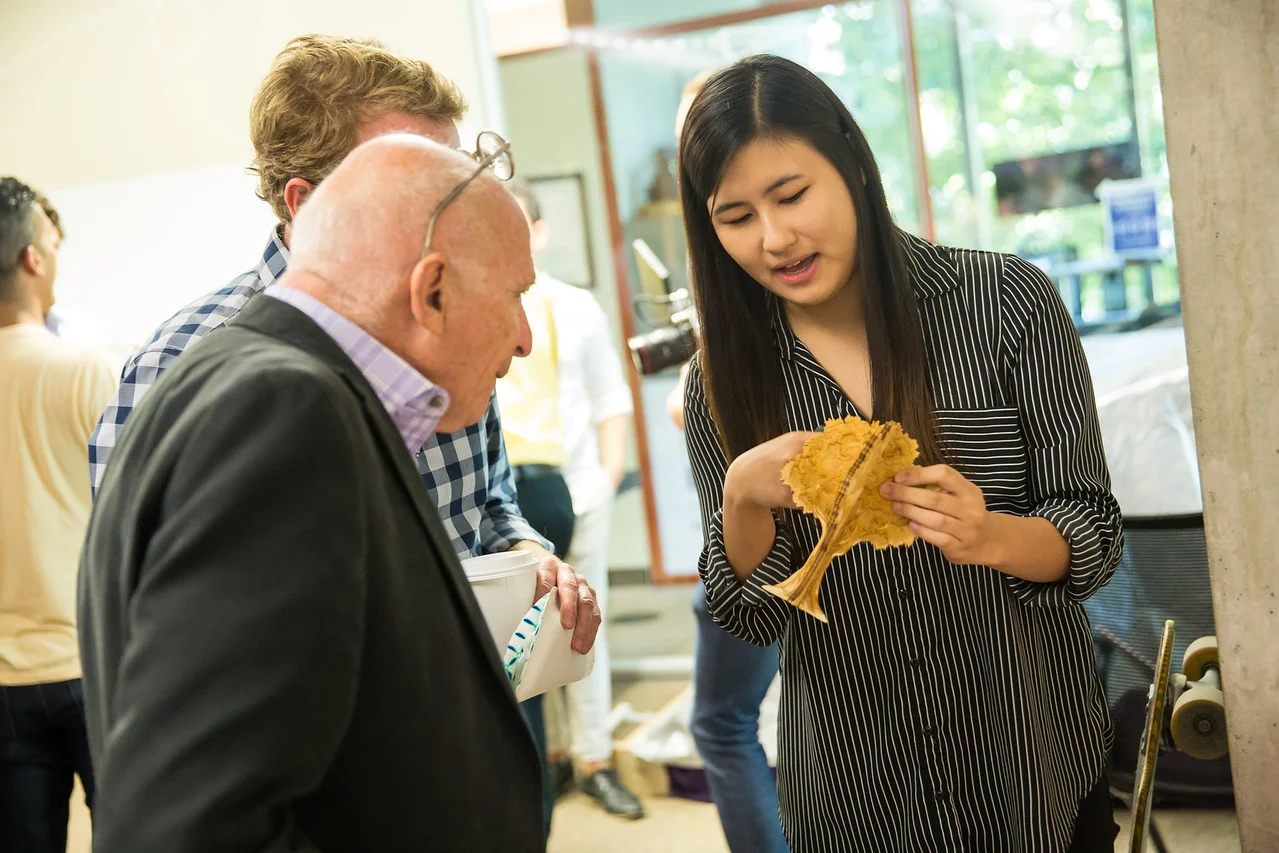 Explaining the laser cut tree design to Professor John Hartman and Dr. Walter Herbst at Northwestern University Engineering Design Innovation 2017 Bootcamp Presentation.