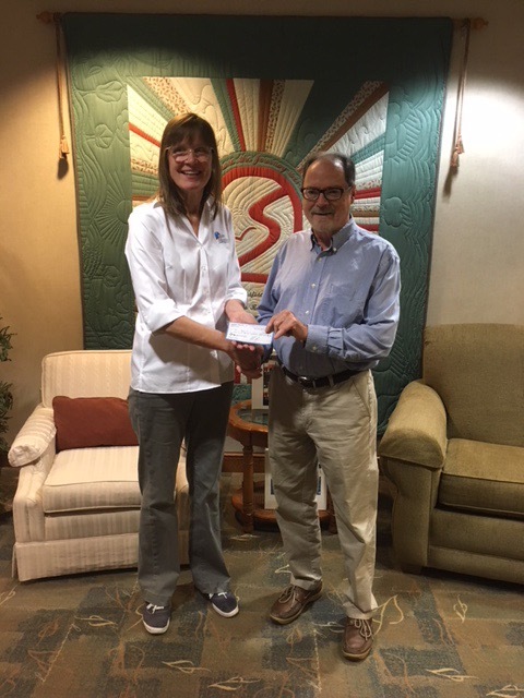 VC Harvey Rickert presented the Chief Operating Officer of Stein Hospice, Tamara Zuilhof, with the funds raised from HBYC’s Race in the Bay for Stein Hospice and social.