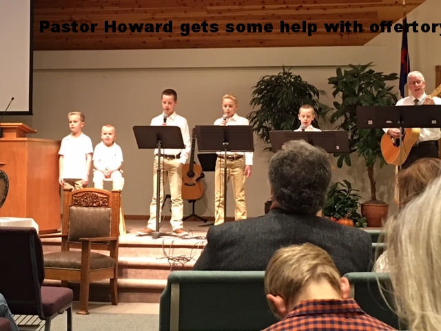 Howard gets some help during offertory
