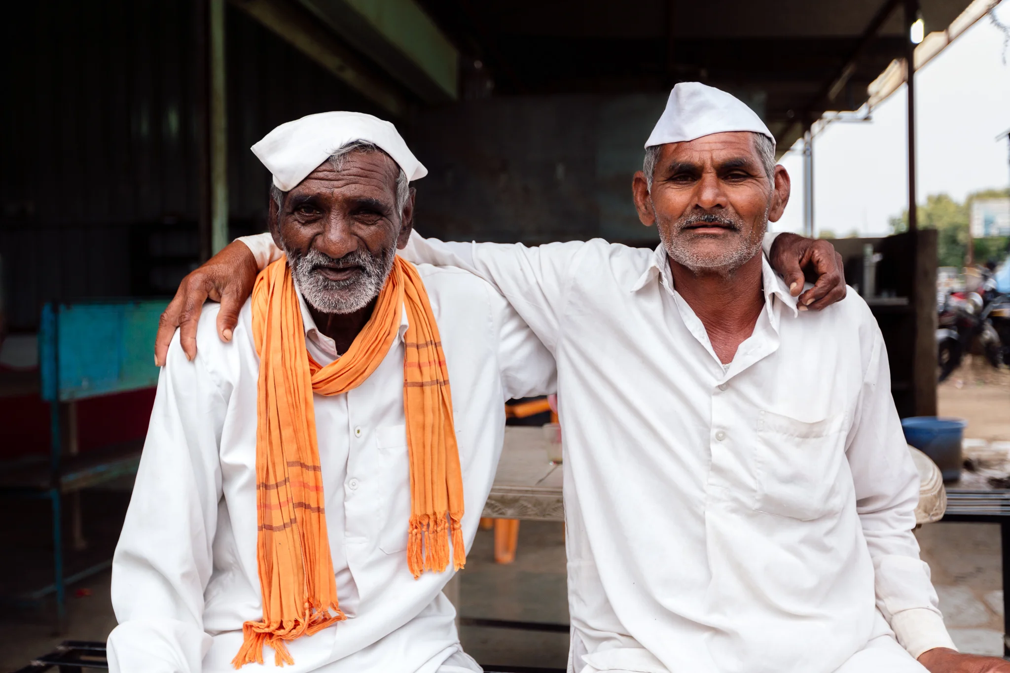 Whenever I’d go into the marketplaces or streets with my camera all eyes were on me and there was a sense of carefulness and skepticism coming from the people. But then I would smile, put my hands up and make the universal sign for “do you want to take picture?” miming taking a picture. Then their eyes would light up and they would point to themselves as if to say, “me?” And I would emphatically nod and point at them and say “yes.” Then all walls were down as they were given the gift of feeling seen. Once after doing that, the brought me towards these men and said “traditional Indian culture here” and had me take a picture of them. There were about 10-15 men behind me as I took this and right before this shot one of them took the man on the left’s hat and turned it mostly sideways and they all laughed.
