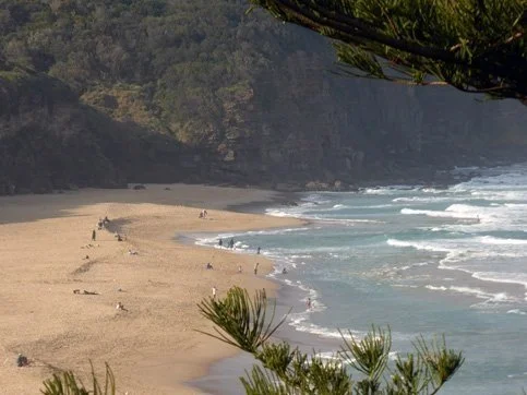 Beach showing a depression the beach and the effect that the riptide has on the beach surf.