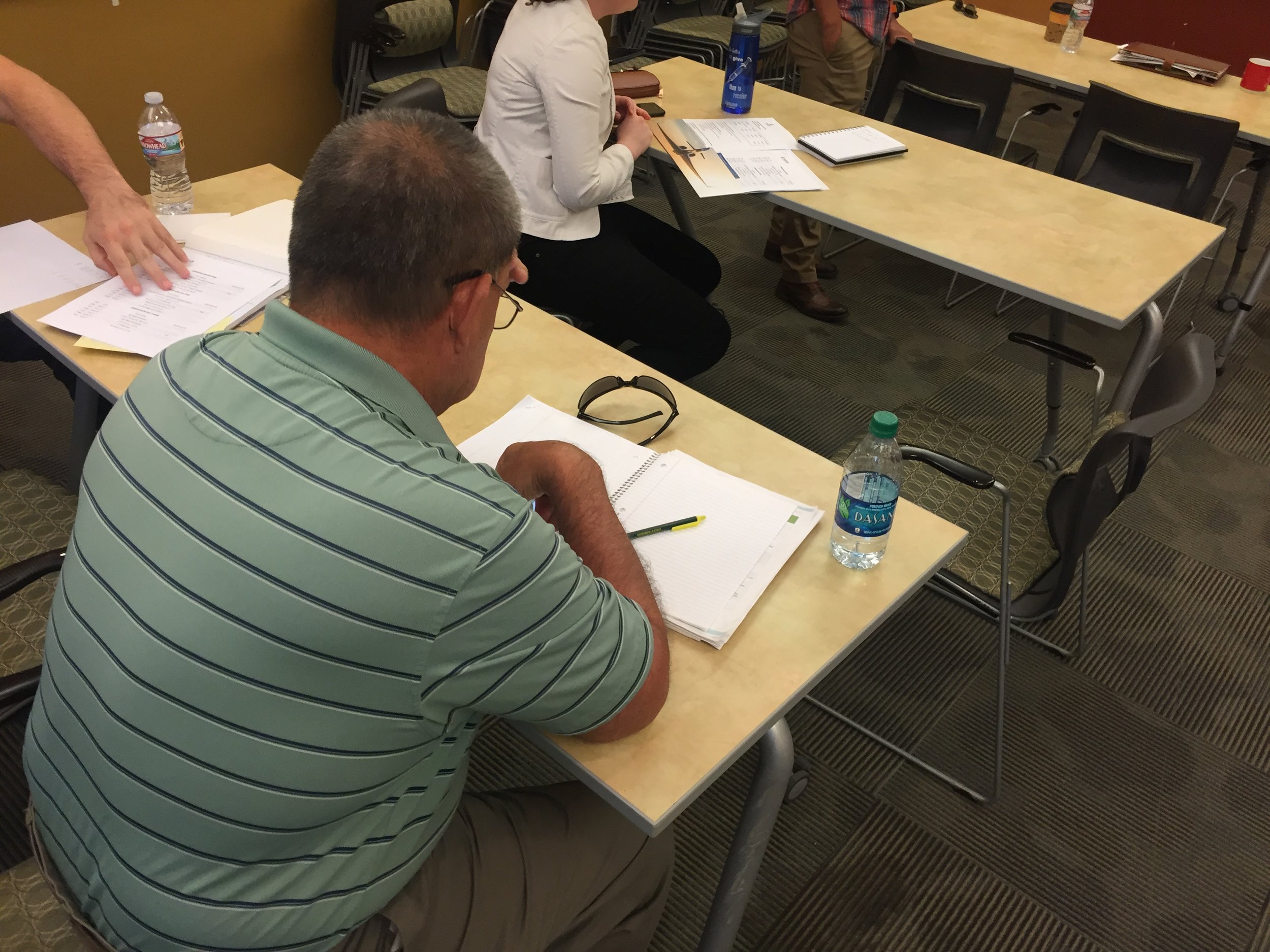 An aeromedical specialist reviewing notes before a test. 