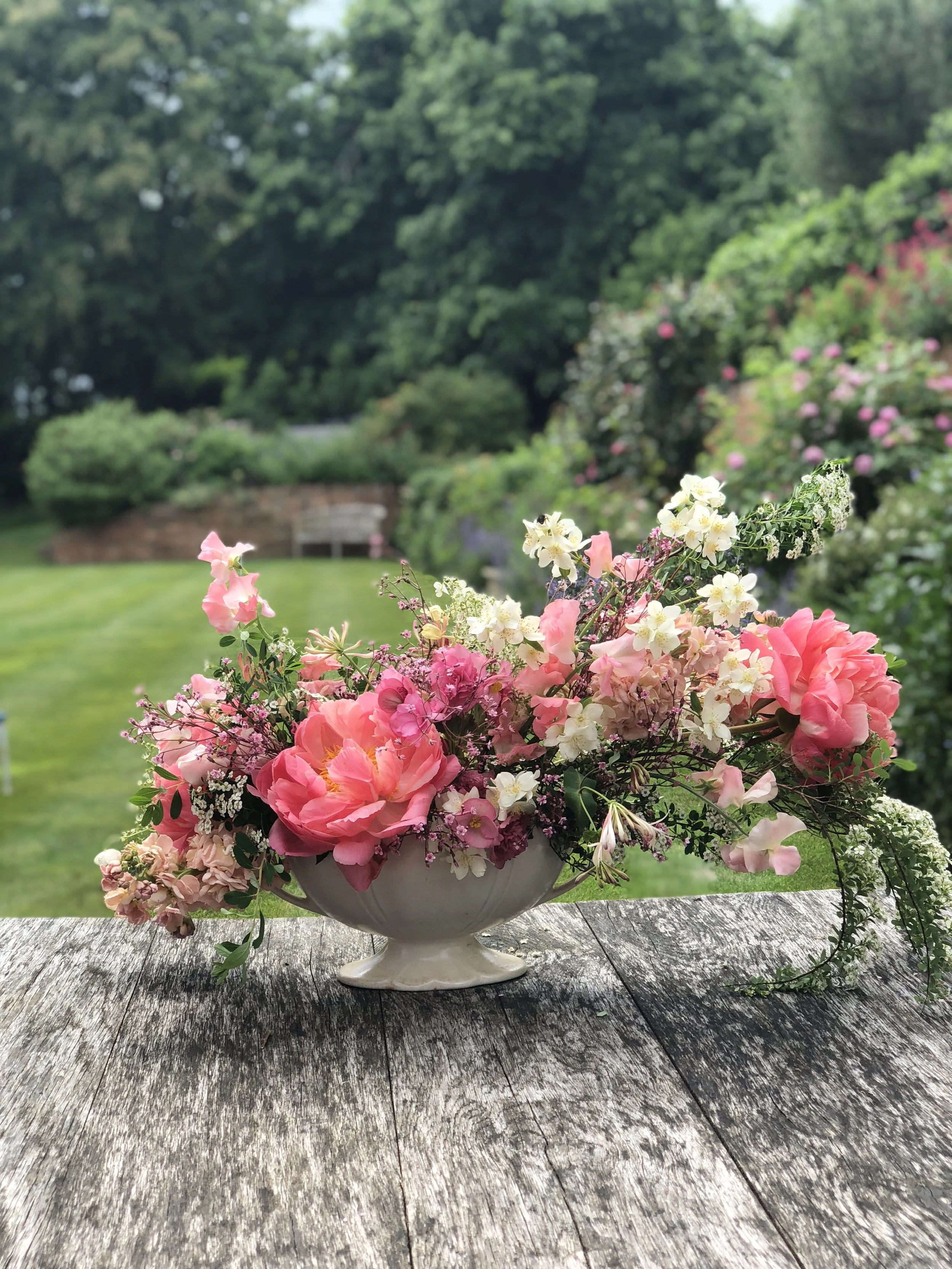 A peony filled Beswick urn.