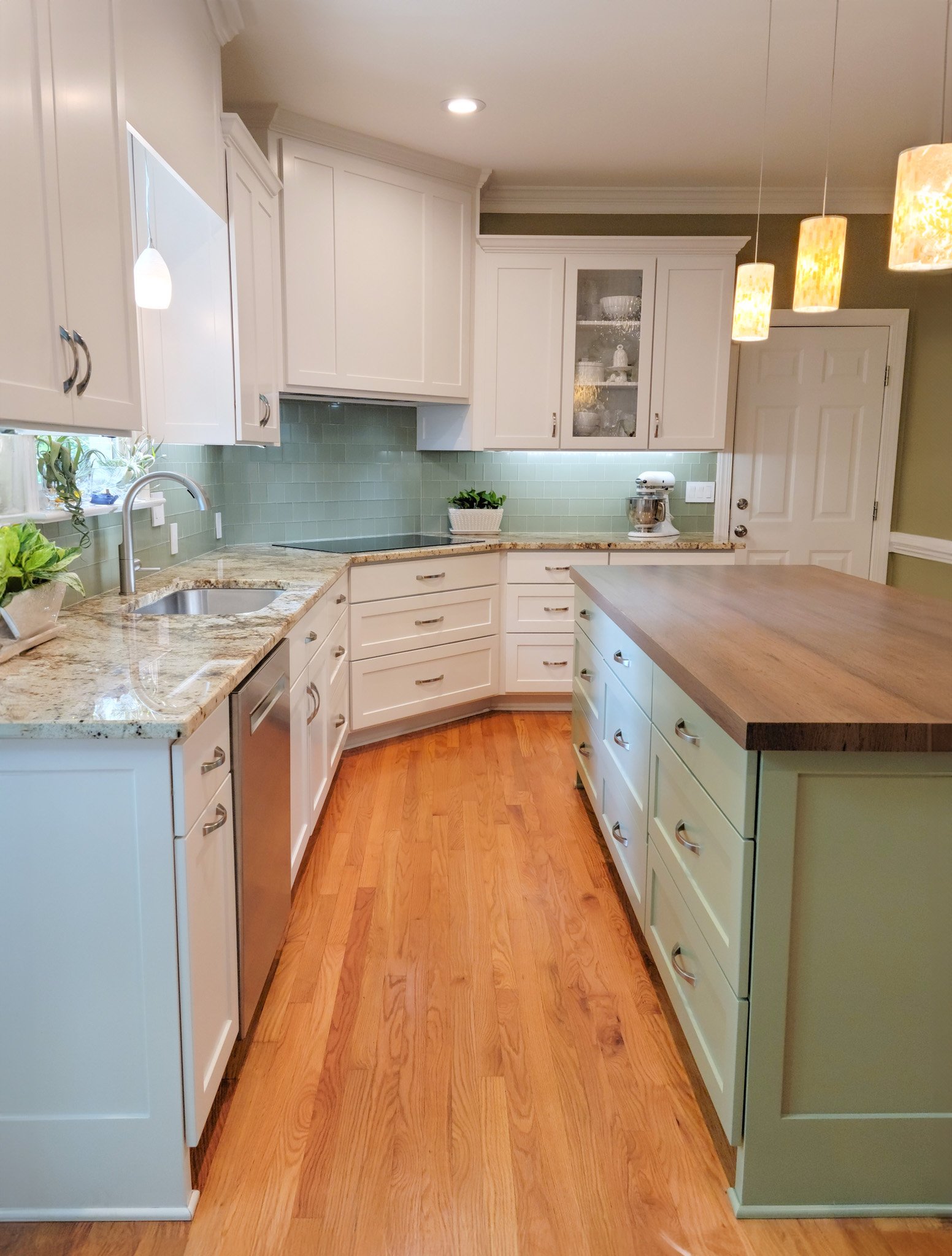 All paint kitchen. White cabinets and Light Green Island