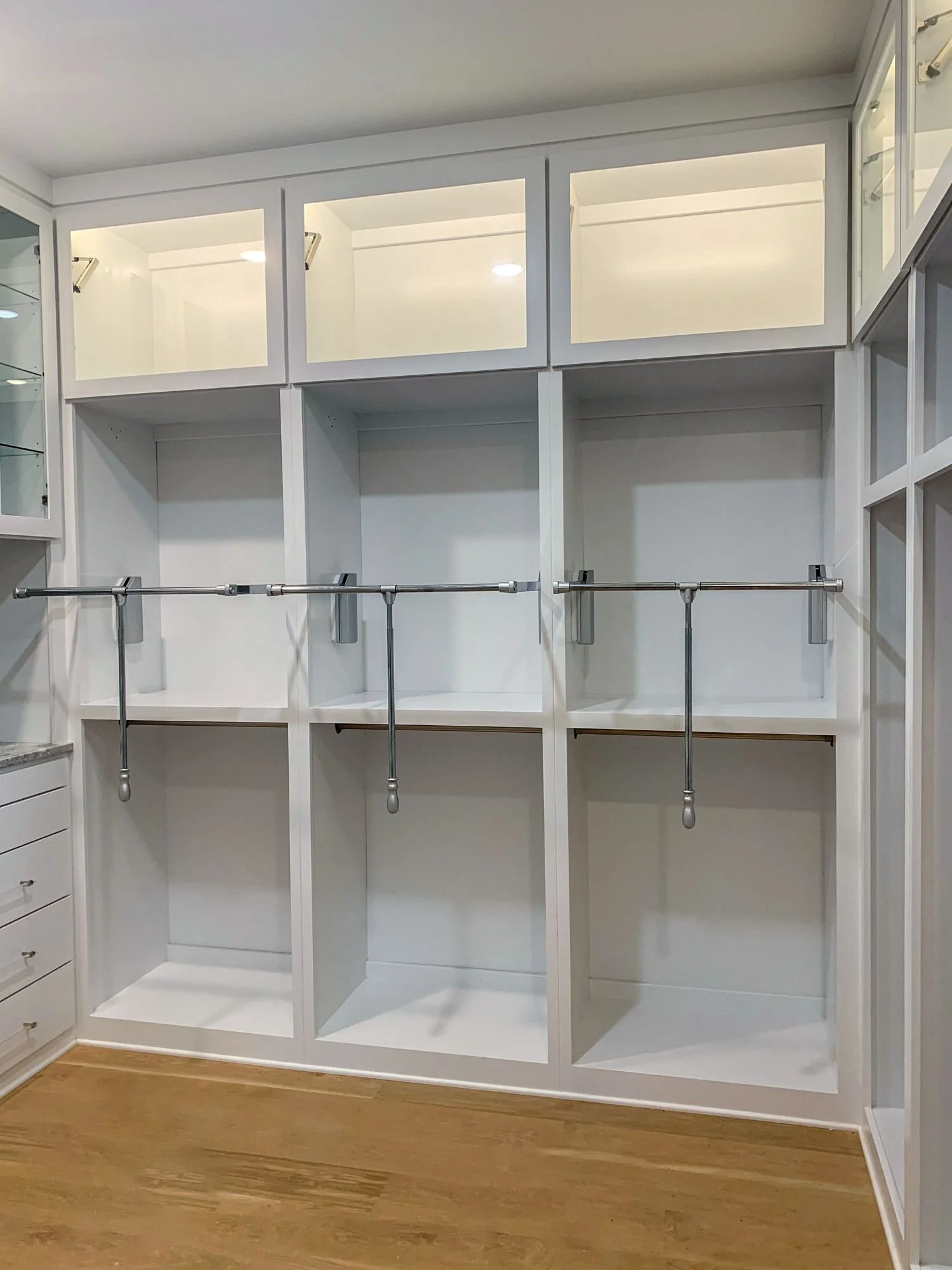 Floor to Ceiling Walk-in Closet with Glass Awning Doors For Decor and Display