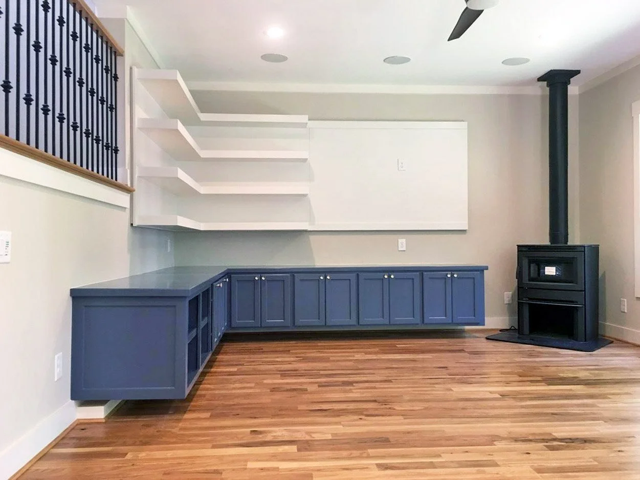 Custom cabinet built-in with blue floating base cabinets.
