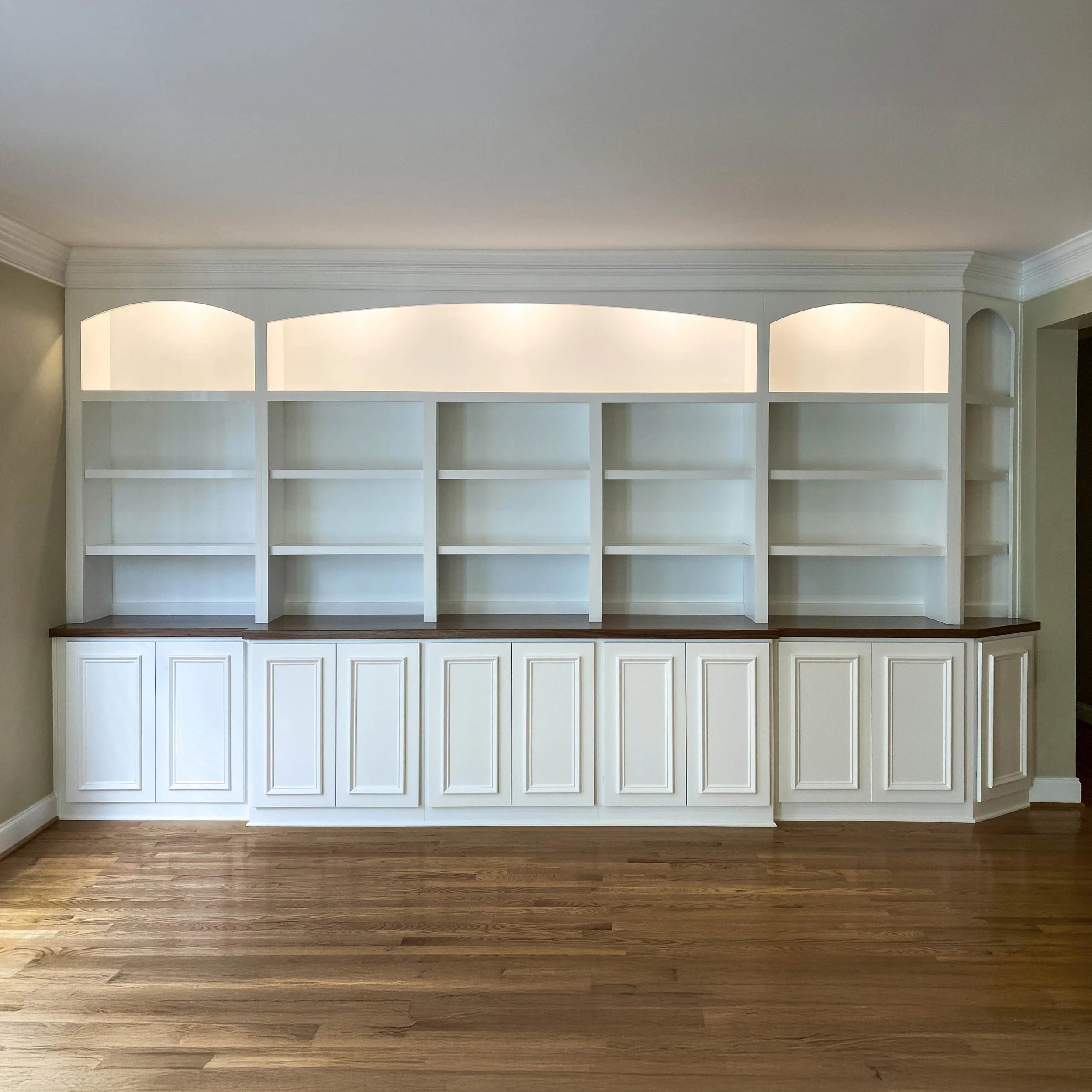 Custom built-in cabinets with segmental arches