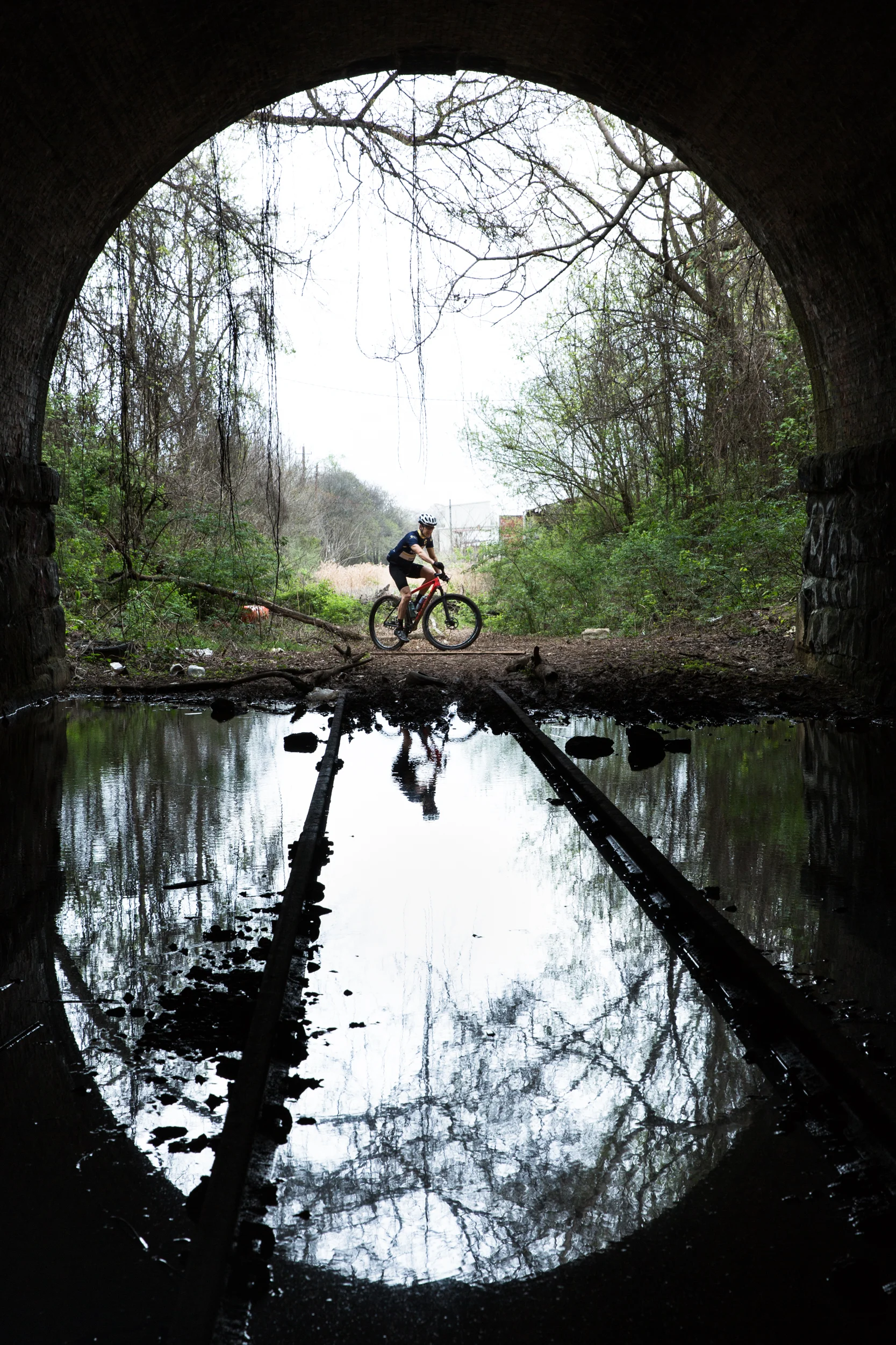 urban mountain biking through tunnel