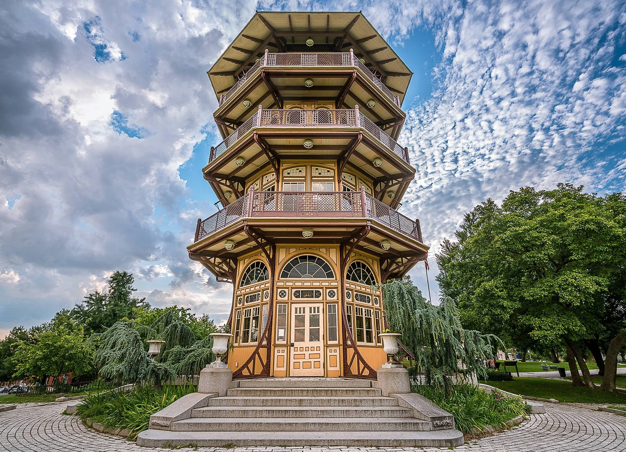 The Pagoda The known as the Pagoda because of its oriental architectural appearance, the design was intended to reflect the bold Victorian style of the day. From the top of the tower one can view downtown, Baltimore’s many neighborhoods, the Patapsco River, the Key Bridge and Fort McHenry. Over time and due to natural decay, vandalism, and lack of maintenance funds, the Pagoda was closed to the public in 1951 when the first of a series of partial renovations was attempted. At one point demolition was proposed as an option but thankfully the 1998 Master Plan for Patterson Park called for the complete restoration of the Pagoda. This project was guided by the Friends of Patterson Park, in partnership with Baltimore City’s Department of Recreation and Parks and MANY neighborhood volunteers. Completed in the spring of 2002, the Pagoda now stands as an iconic structure for Patterson Park and Baltimore City and signified the renaissance of the community around Patterson Park. It is also the location of many programs and events, such as the Friends of Patterson Park Summer Concerts Series, Audubon’s family programs, Tour Dem Parks waterstop, one of the sites of AVAM’s Kinetic Sculpture Race obstacles, The Friends’ annual Moonlight Pagoda event and much, much more! The Pagoda is operated, maintained and staffed by The Friends of Patterson Park and volunteers. The Pagoda is open 12 noon to 6 pm on Sundays from mid-April through mid-October.